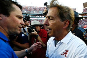 TUSCALOOSA, AL - SEPTEMBER 20:  Head coach Nick Saban of the Alabama Crimson Tide shakes hands with head coach Will Muschamp of the Florida Gators after their 42-21 win at Bryant-Denny Stadium on September 20, 2014 in Tuscaloosa, Alabama.  (Photo by Kevin