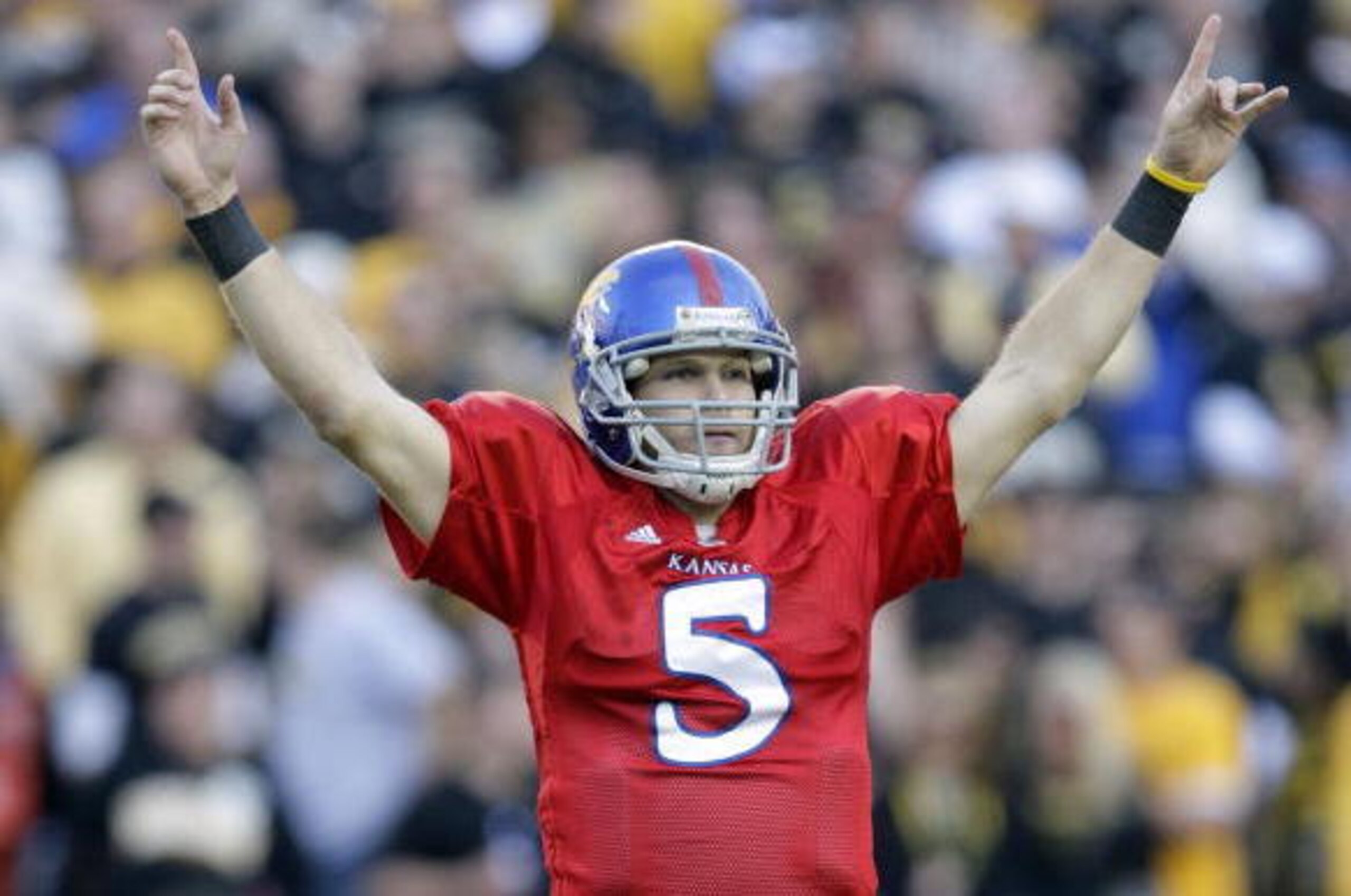 KANSAS CITY, MO - NOVEMBER 28: Quarterback Todd Reesing #5 of the Kansas Jayhawks celebrates after a play during the game against the Missouri Tigers at Arrowhead Stadium on November 28, 2009 in Kansas City, Missouri. (Photo by Jamie Squire/Getty Images) KANSAS CITY, MO - NOVEMBER 28: Quarterback Todd Reesing #5 of the Kansas Jayhawks celebrates after a play during the game against the Missouri Tigers at Arrowhead Stadium on November 28, 2009 in Kansas City, Missouri. (Photo by Jamie Squire/Getty Images)