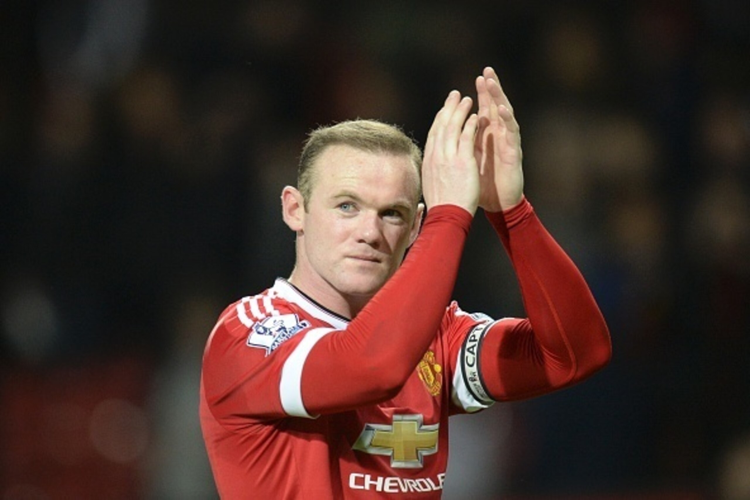 Manchester United's English striker Wayne Rooney applauds to acknowledge the crowd after the final whistle during the English Premier League football match between Manchester United and Chelsea at Old Trafford in Manchester, north west England, on Decembe