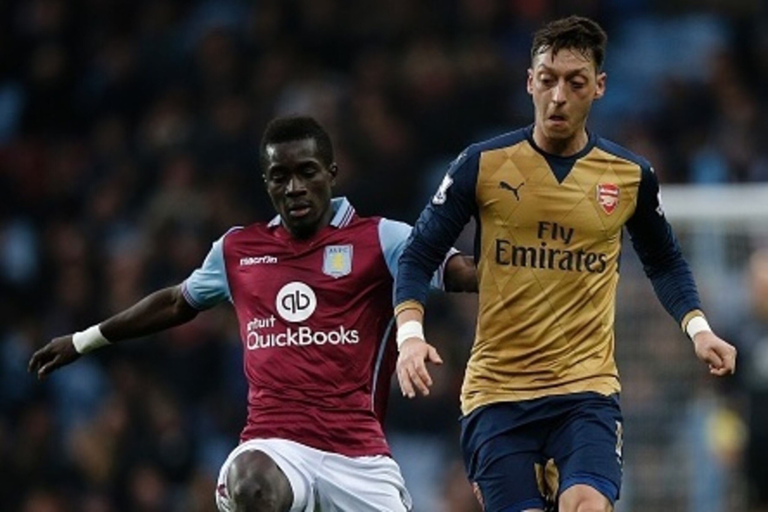 Aston Villa's Senegalese midfielder Idrissa Gueye (L) vies with Arsenal's German midfielder Mesut Ozil during the English Premier League football match between Aston Villa and Arsenal at Villa Park in Birmingham, central England on December 13, 2015. Arse Aston Villa's Senegalese midfielder Idrissa Gueye (L) vies with Arsenal's German midfielder Mesut Ozil during the English Premier League football match between Aston Villa and Arsenal at Villa Park in Birmingham, central England on December 13, 2015. Arse