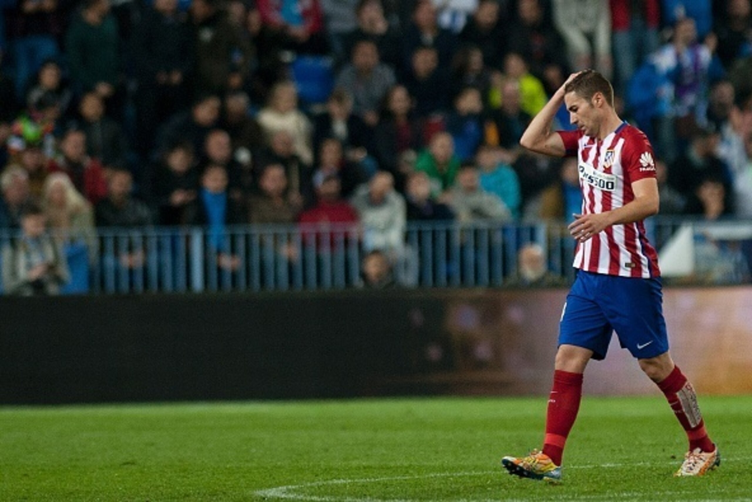 Atletico Madrid's midfielder Gabi reacts after receiving a red card during the Spanish league football match Malaga CF vs Club Atletico de Madrid at La Rosaleda stadium in Malaga on December 20, 2015.   AFP PHOTO/ JORGE GUERRERO / AFP / Jorge Guerrero    