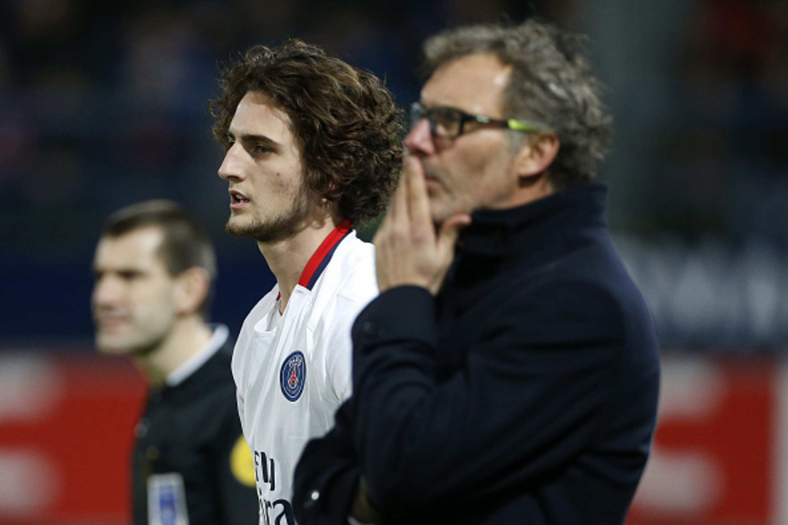 CAEN, FRANCE - DECEMBER 19: Coach of PSG Laurent Blanc and Adrien Rabiot of PSG (left) look on during the French Ligue 1 match between Stade Malherbe de Caen and Paris Saint-Germain (PSG) at Stade Michel D'Ornano on December 19, 2015 in Caen, France. (Pho