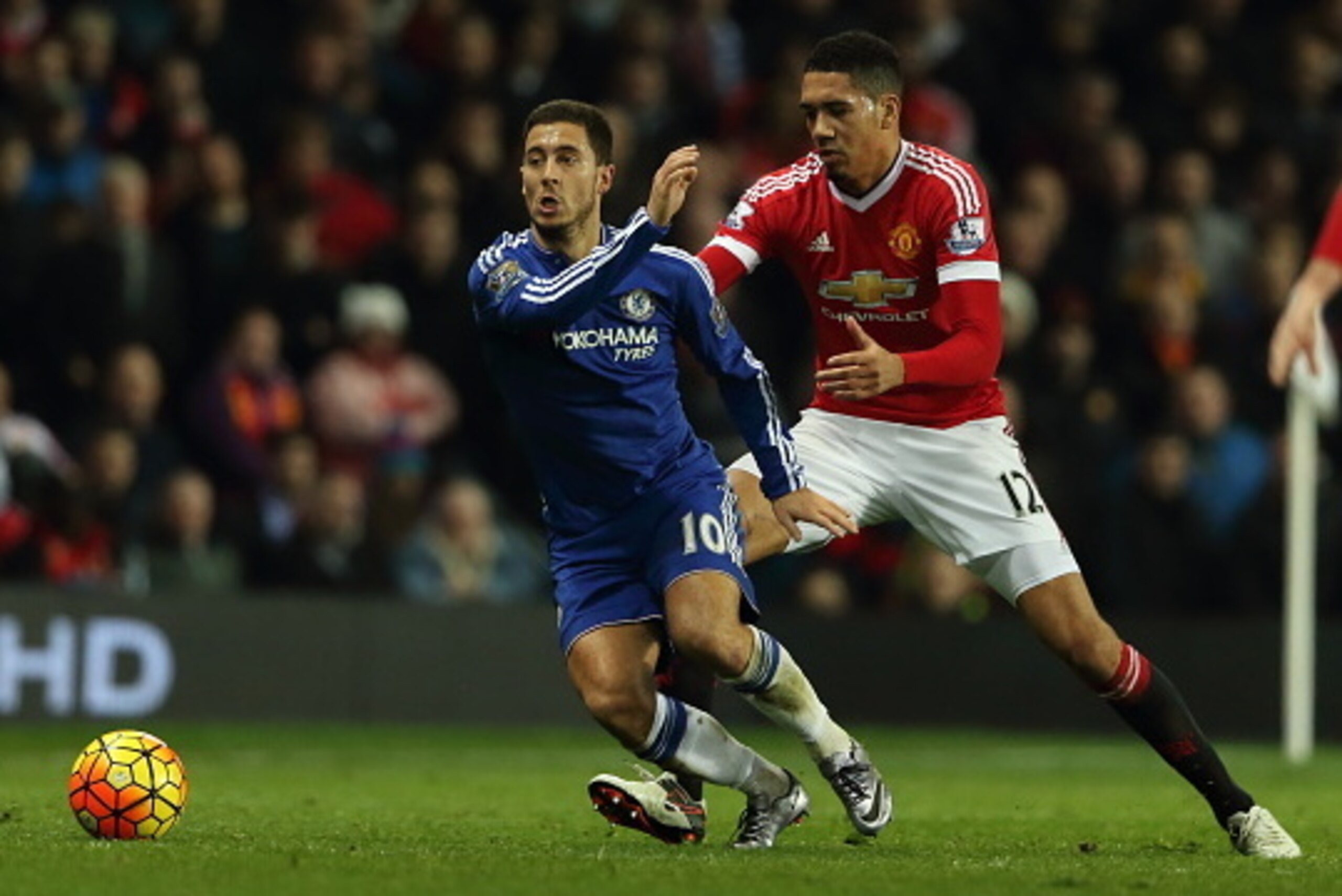 MANCHESTER, ENGLAND - DECEMBER 28: Eden Hazard of Chelsea and Chris Smalling of Manchester United during the Barclays Premier League match between Manchester Untied and Chelsea at Old Trafford on December 28, 2015 in Manchester, England.  (Photo by Matthe