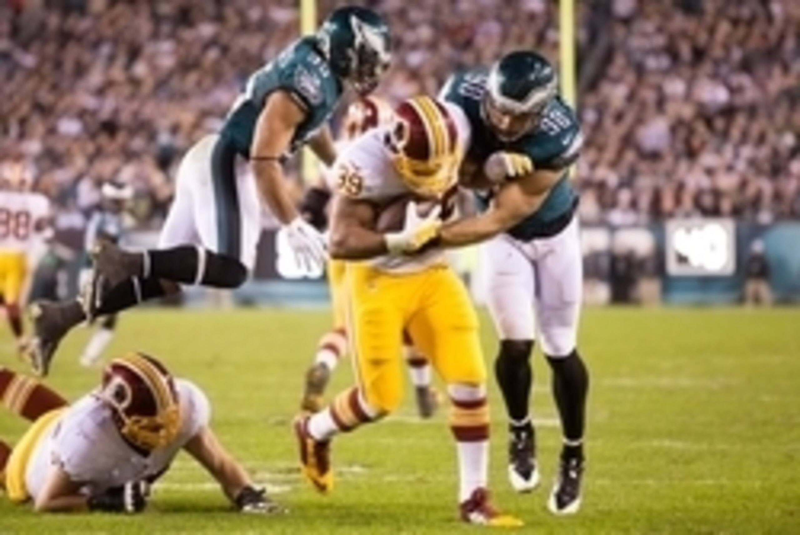 Dec 26, 2015; Philadelphia, PA, USA; Washington Redskins running back Pierre Thomas (39) runs with the ball against the defense of Philadelphia Eagles outside linebacker Connor Barwin (98) and inside linebacker Mychal Kendricks (95) during the second quar