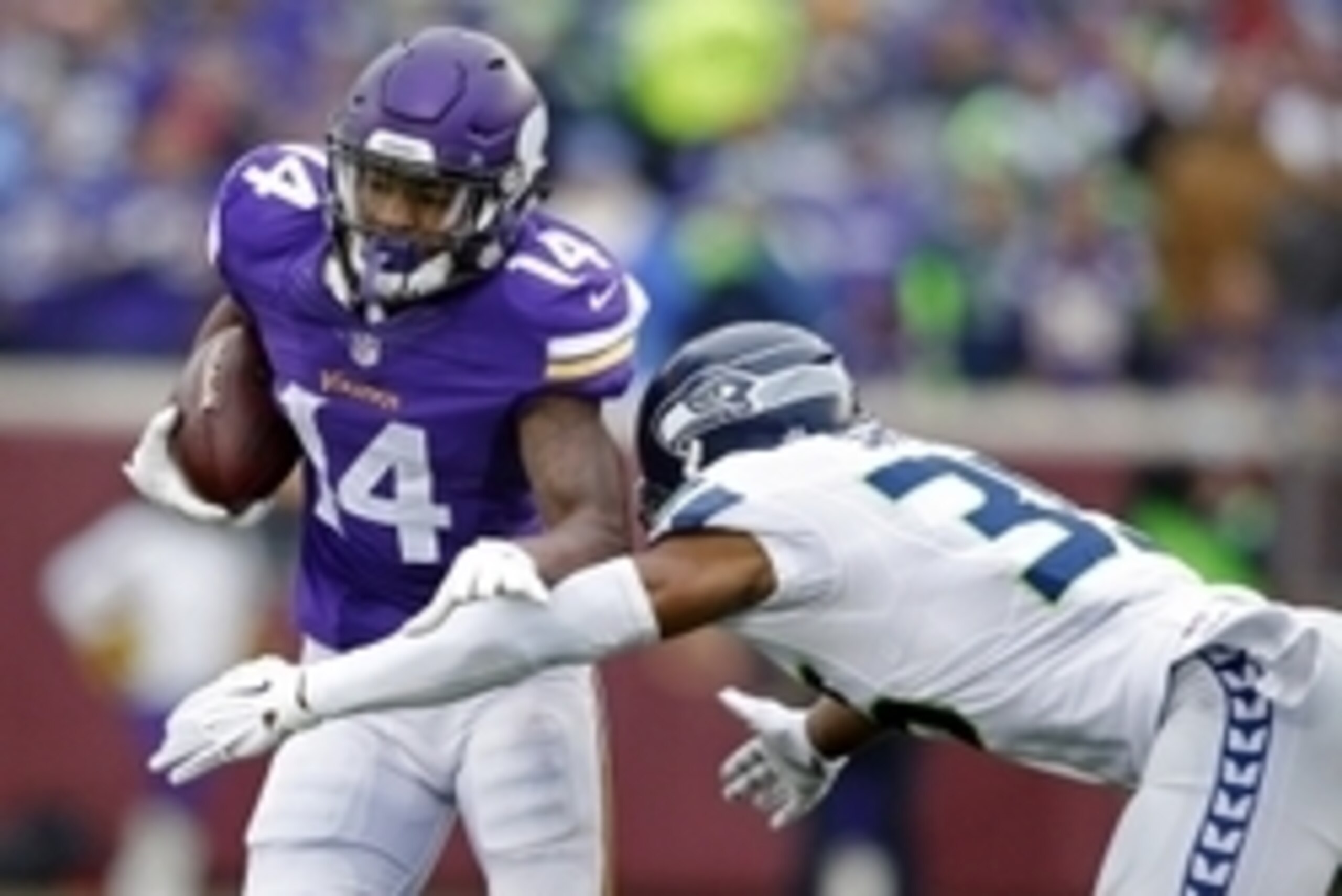 Dec 6, 2015; Minneapolis, MN, USA; Minnesota Vikings wide receiver Stefon Diggs (14) catches a pass as Seattle Seahawks safety DeShawn Shead (35) defends him in the second quarter at TCF Bank Stadium. The Seahawks won 38-7. Mandatory Credit: Bruce Kluckho