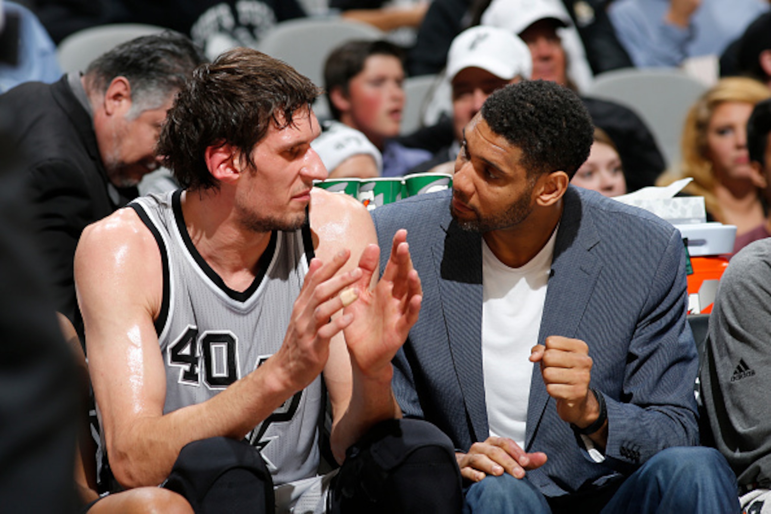 SAN ANTONIO, TX - DECEMBER 26:  Boban Marjanovic #40 of the San Antonio Spurs and Tim Duncan #21 of the San Antonio Spurs talk during the game against the Denver Nuggets on December 26, 2015 at the AT&T Center in San Antonio, Texas. NOTE TO USER: User exp