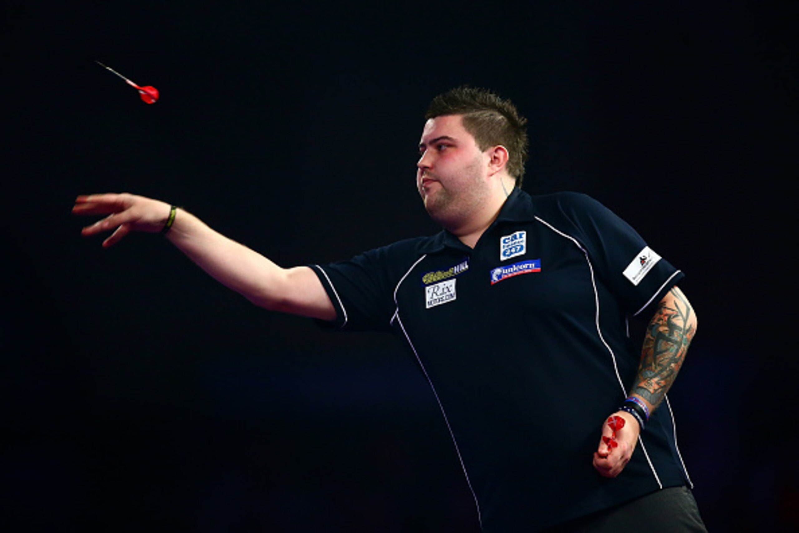 LONDON, ENGLAND - DECEMBER 29:  Michael Smith of England in action in his third round match against Benito van de Pas of Holland on Day Eleven of the 2016 William Hill PDC World Darts Championships at Alexandra Palace on December 29, 2015 in London, Engla