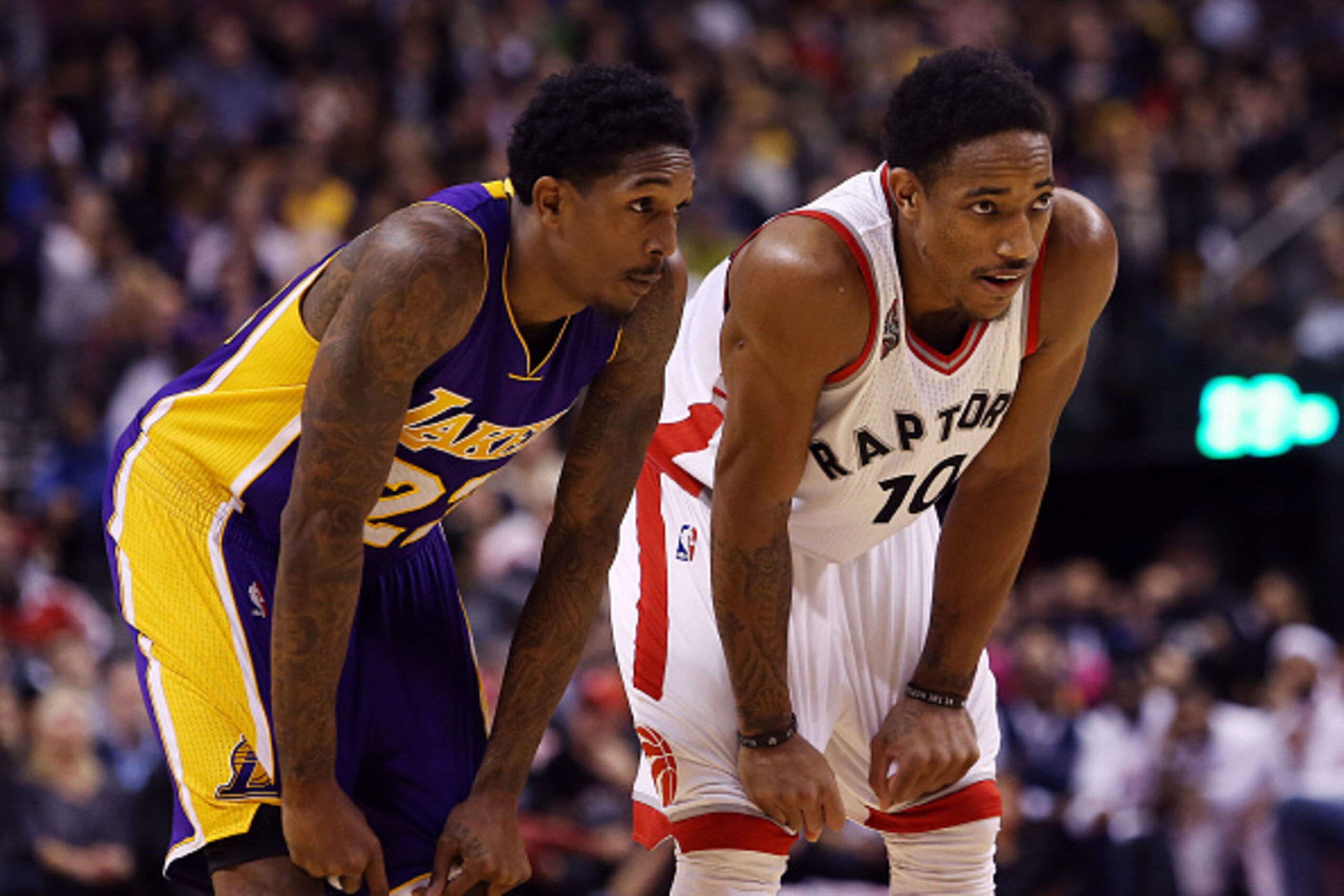 TORONTO, ON - DECEMBER 07:  Lou Williams #23 of the Los Angeles Lakers chats with DeMar DeRozan #10 of the Toronto Raptors during an NBA game at the Air Canada Centre on December 07, 2015 in Toronto, Ontario, Canada.  NOTE TO USER: User expressly acknowle