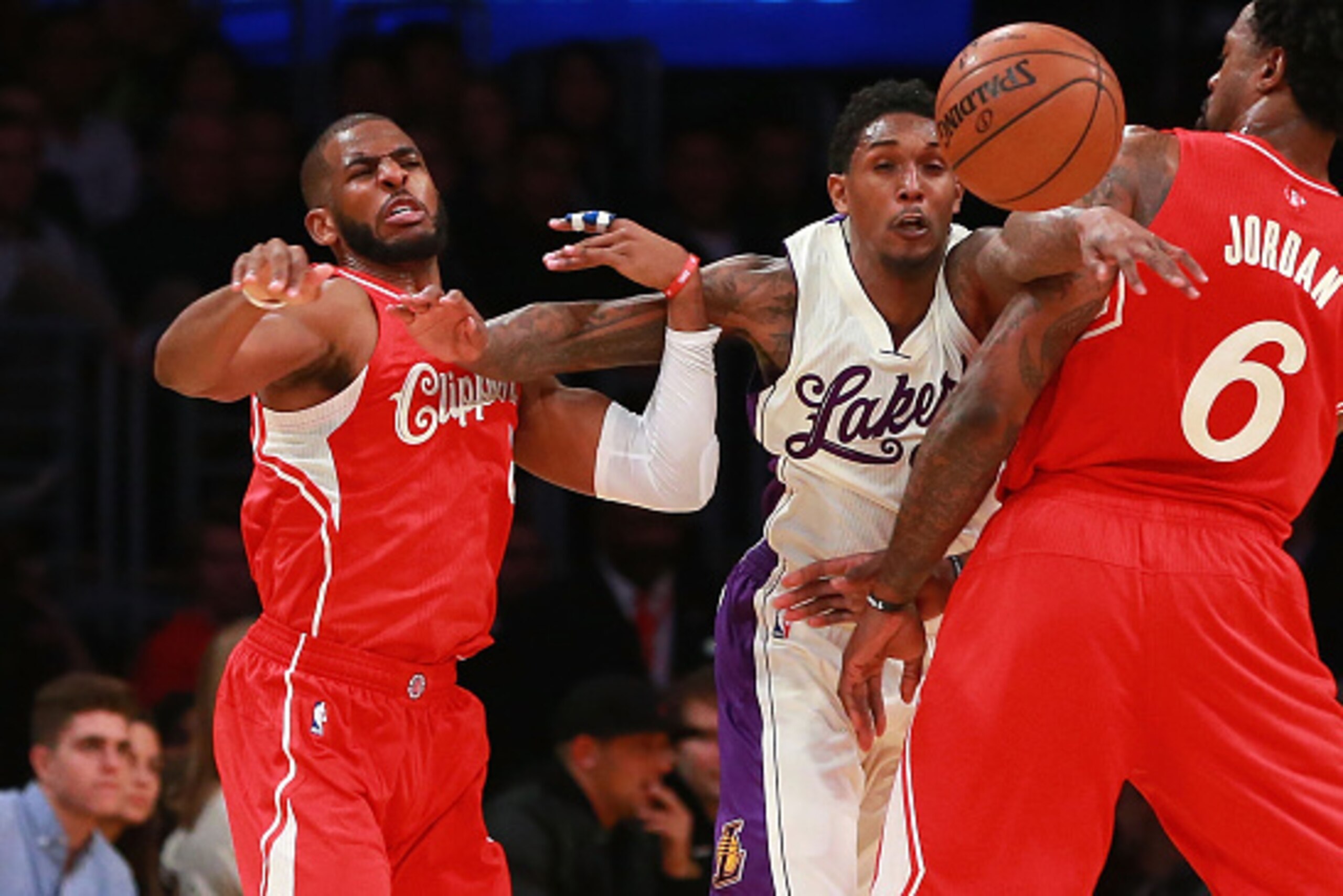 LOS ANGELES, CA - DECEMBER 25: Lou Williams #23 of the Los Angeles Lakers pursues the ball between Chris Paul #3 and DeAndre Jordan #6 of the Los Angeles Clippers in the second half of their NBA game at Staples Center on December 25, 2015 in Los Angeles, 