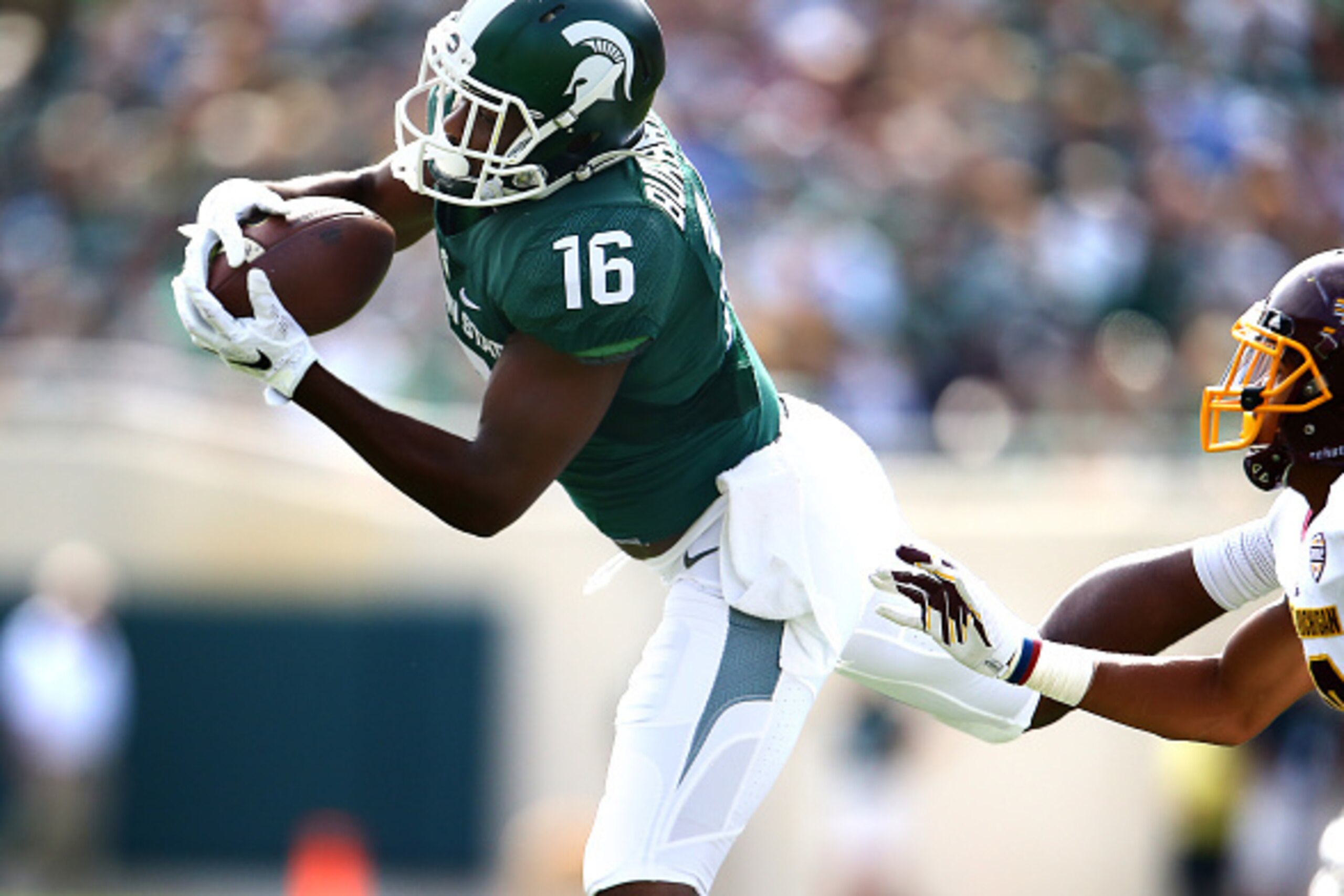 EAST LANSING, MI - SEPTEMBER 26: Aaron Burbridge #16 of the Michigan State Spartans makes a catch in the fourth quarter against the Central Michigan Chippewas at Spartan Stadium on September 26, 2015 in East Lansing, Michigan. (Photo by Rey Del Rio/Getty 