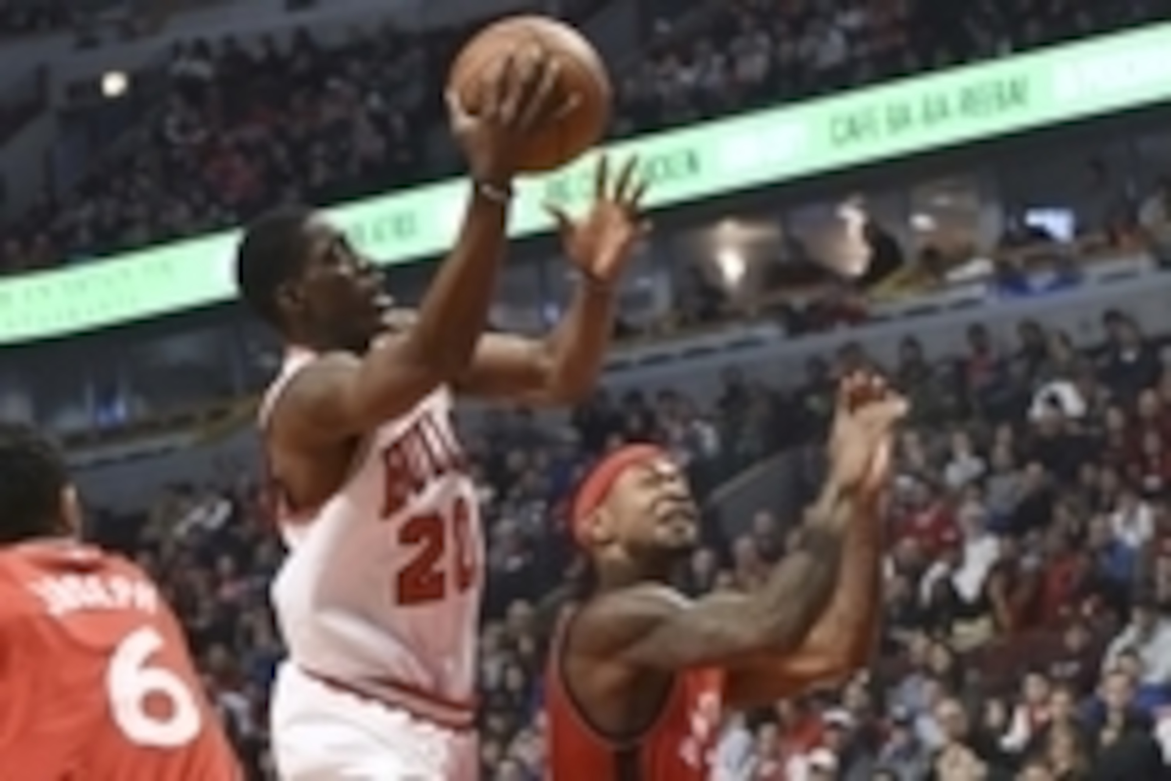 Dec 28, 2015; Chicago, IL, USA; Chicago Bulls forward Tony Snell (20) prepares to shoot the ball as Toronto Raptors forward Terrence Ross (31) defends during the first half at  the United Center. Mandatory Credit: David Banks-USA TODAY Sports