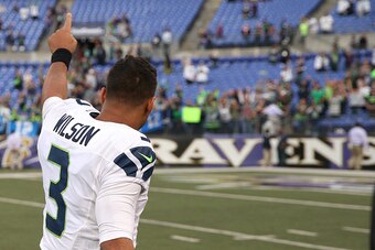 BALTIMORE, MD - DECEMBER 13: Quarterback Russell Wilson #3 of the Seattle Seahawks acknowledges the crowd after defeating the Baltimore Ravens 35-6 at M&T Bank Stadium on December 13, 2015 in Baltimore, Maryland. (Photo by Patrick Smith/Getty Images)