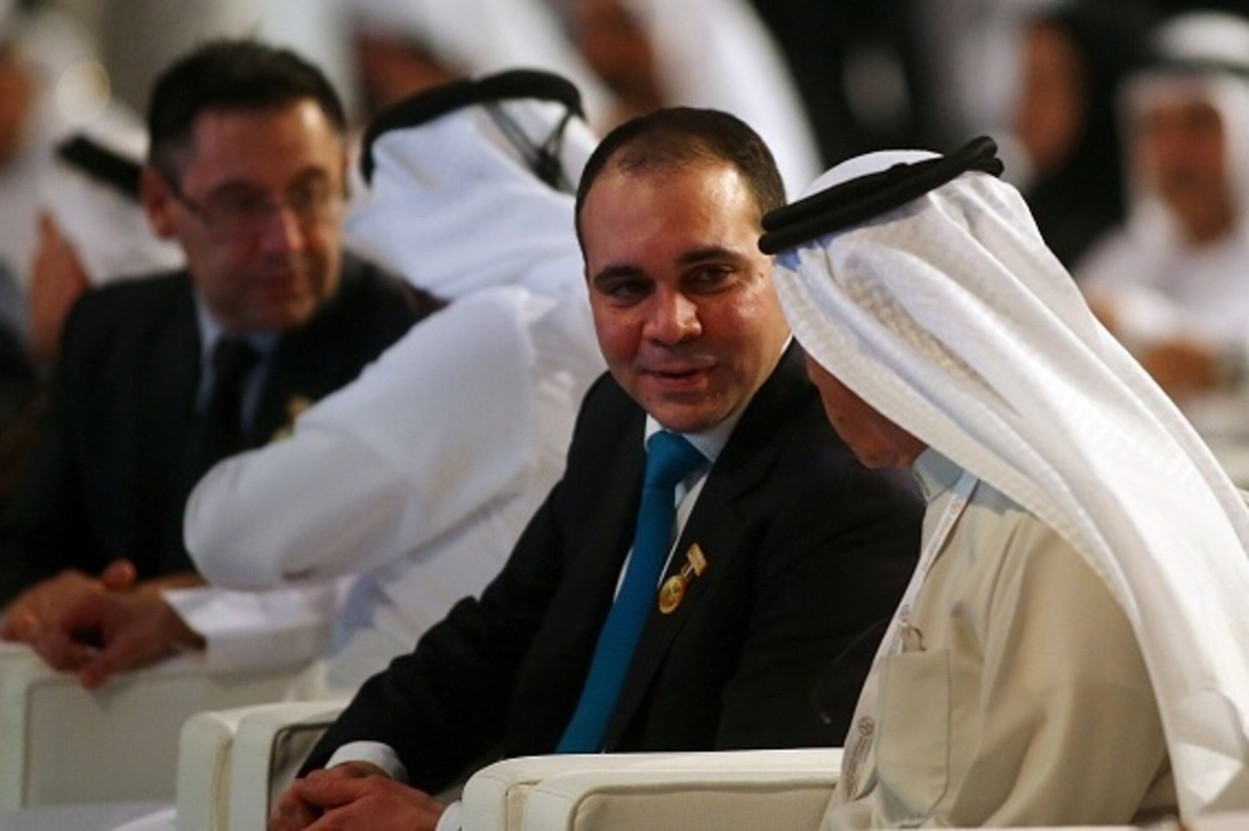 Jordanian Prince and President of Jordan Football Association Ali bin al-Hussein (2R) speaks with an United Arab Emirates official as Barcelona's President Josep Maria Bartomeu (L) speaks with Sheikh Ahmad Bin Rashid al-Maktoum, the son of the ruler of Du