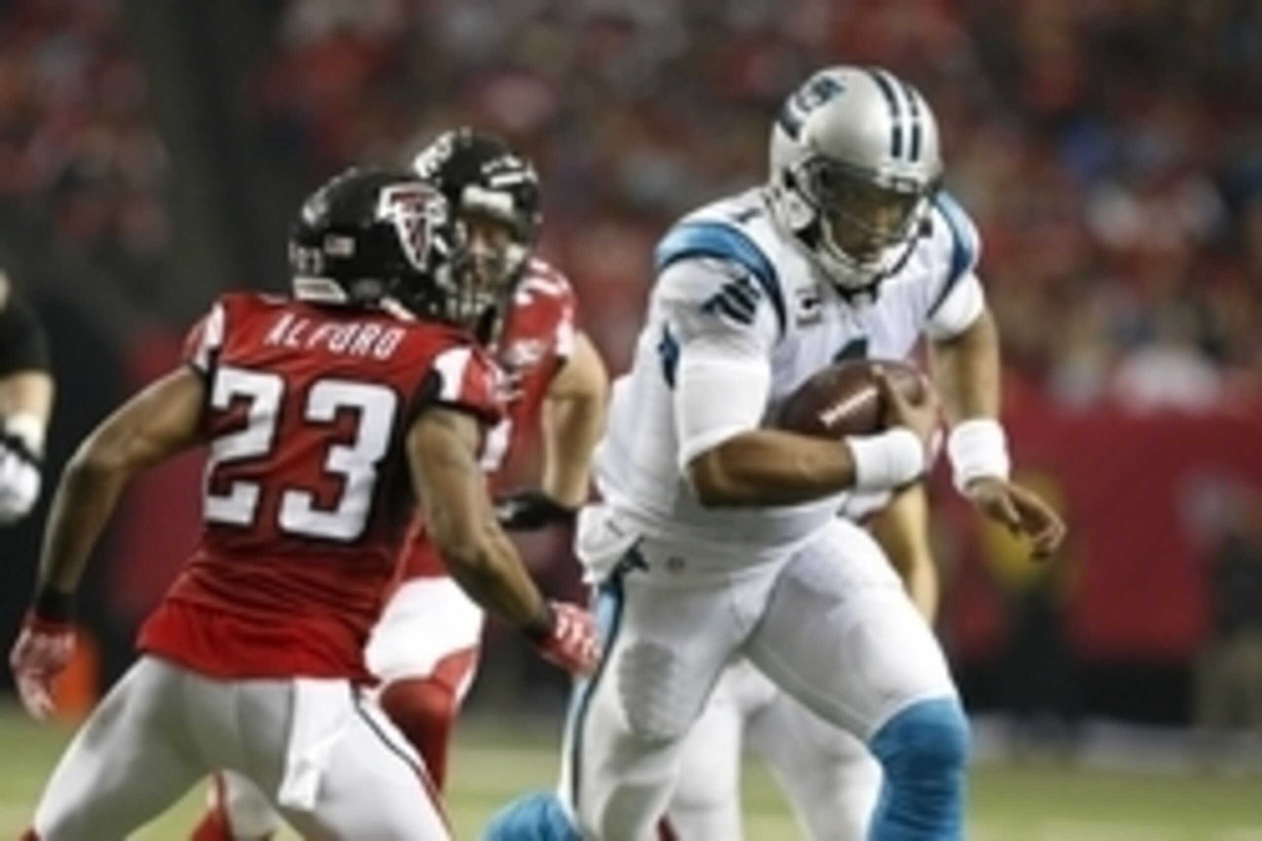 Dec 27, 2015; Atlanta, GA, USA; Carolina Panthers quarterback Cam Newton (1) carries the ball past Atlanta Falcons cornerback Robert Alford (23) in the third quarter  at the Georgia Dome. Mandatory Credit: Jason Getz-USA TODAY Sports