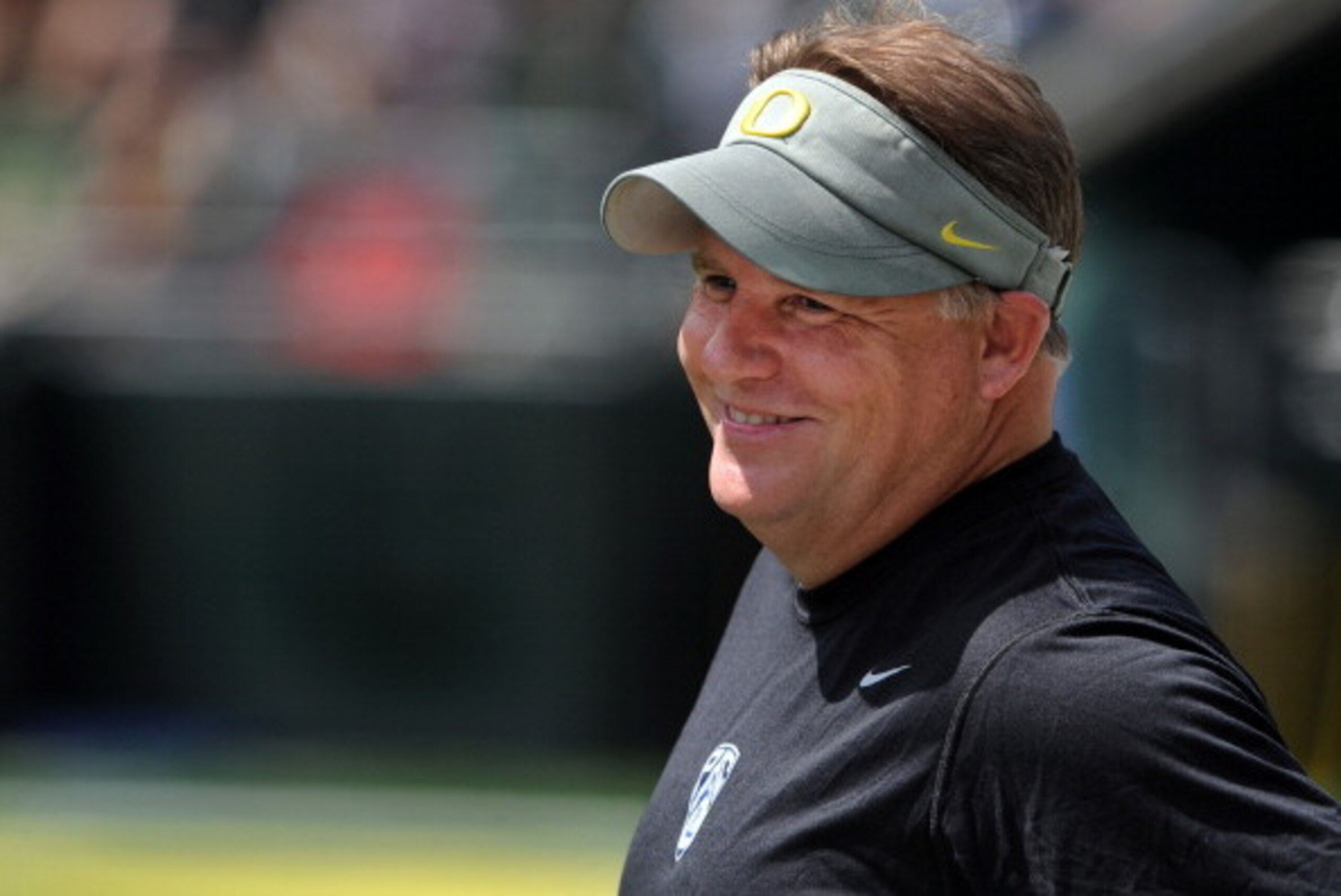 EUGENE, OR - APRIL 28: Head coach Chip Kelly of the Oregon Ducks smiles as he looks on from the sidelines during the third quarter of the Oregon Spring Game game at Autzen Stadium on April 28, 2012 in Eugene, Oregon. (Photo by Steve Dykes/Getty Images)