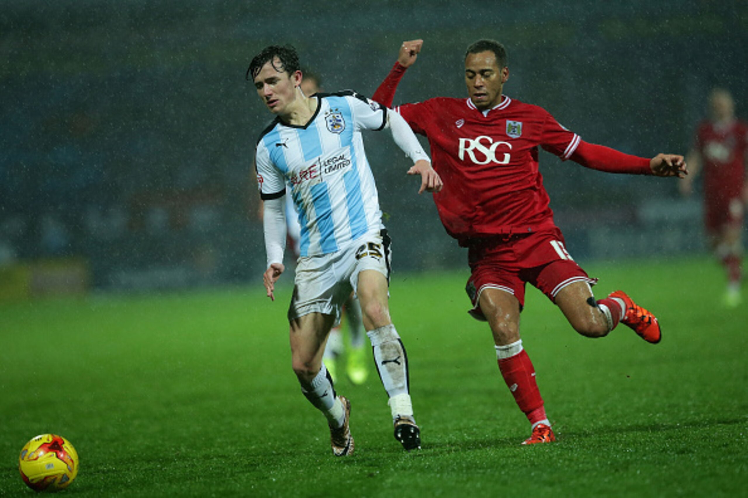 HUDDERSFIELD, ENGLAND - DECEMBER 12:  Ben Chilwell of Huddersfield Town FC is under pressure from Elliott Bennett of Bristol City FC during the Sky Bet Championship match between Huddersfield Town and Bristol City on December 12, 2015 in Huddersfield, Uni
