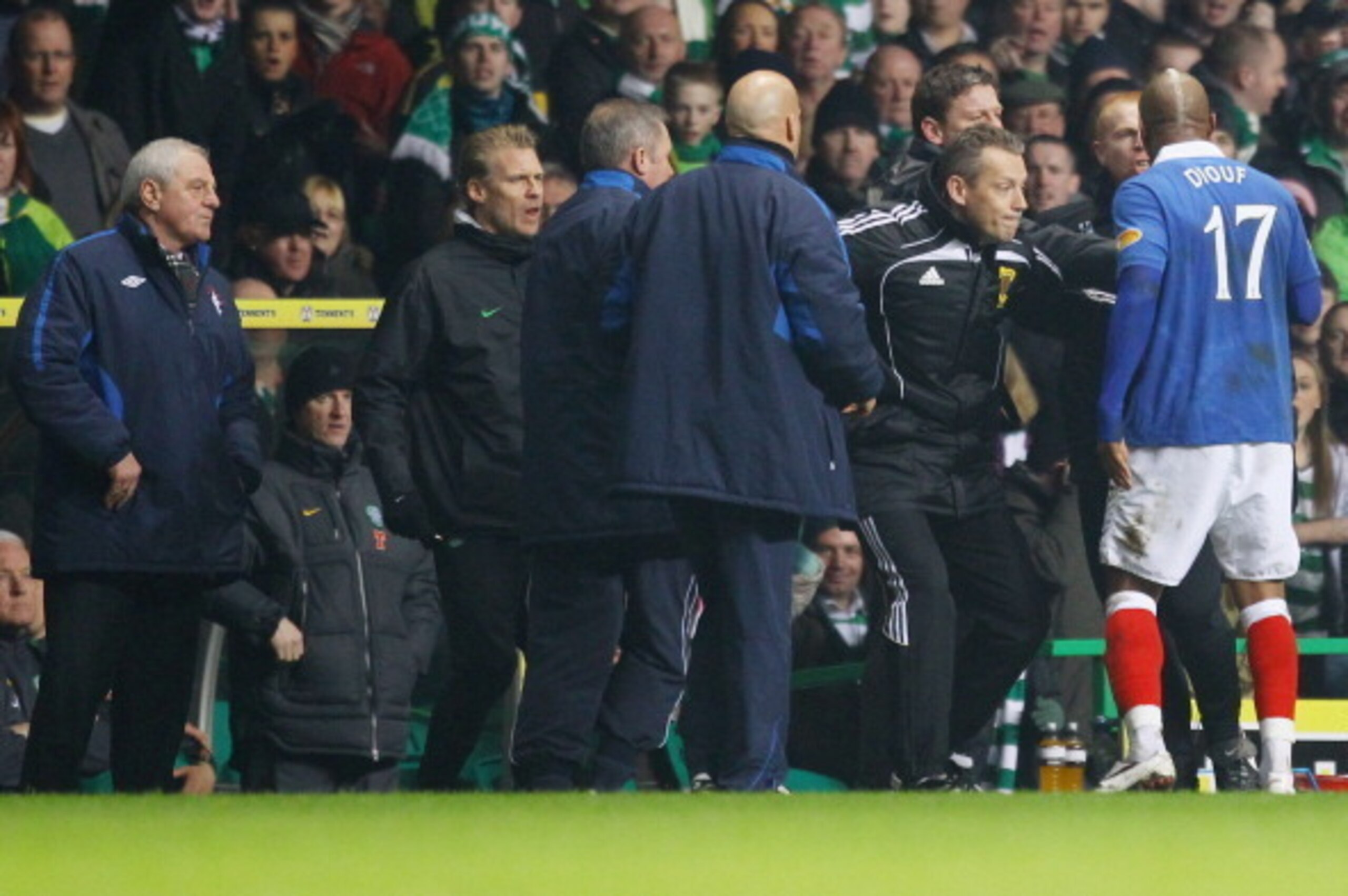 GLASGOW, SCOTLAND - MARCH 02: Neil Lennon coach of Celtic reacts with El Hadji Diouf #17 of Rangers during the Scottish Cup fifth round match between Celtic and Rangers at Celtic Park on March 2, 2011 in Glasgow, Scotland. (Photo by Jeff J Mitchell/Getty GLASGOW, SCOTLAND - MARCH 02: Neil Lennon coach of Celtic reacts with El Hadji Diouf #17 of Rangers during the Scottish Cup fifth round match between Celtic and Rangers at Celtic Park on March 2, 2011 in Glasgow, Scotland. (Photo by Jeff J Mitchell/Getty