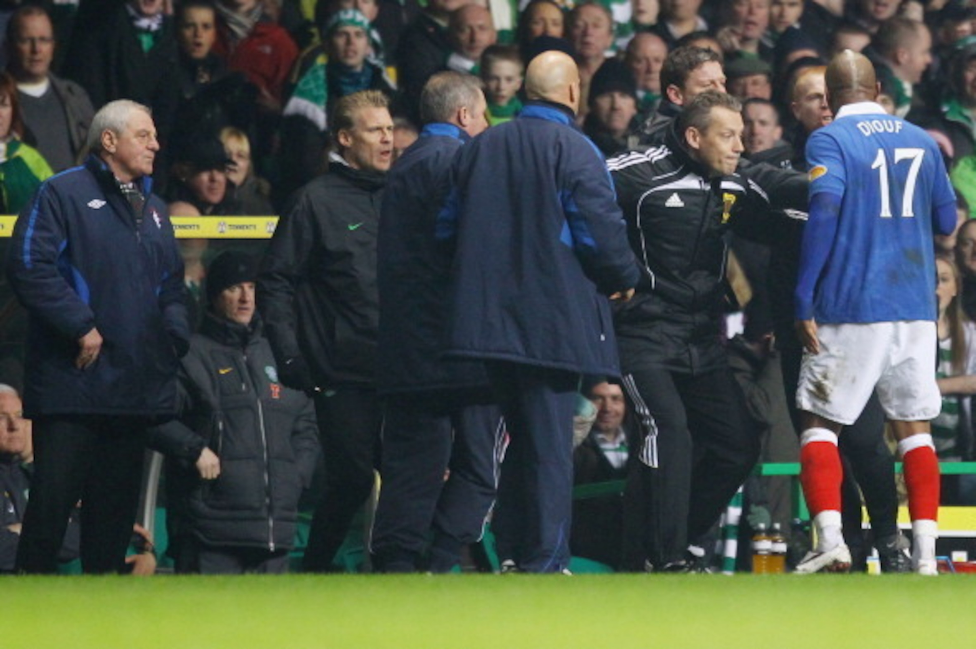 GLASGOW, SCOTLAND - MARCH 02:  Neil Lennon coach of Celtic reacts with El Hadji Diouf #17 of Rangers during the Scottish Cup fifth round match between Celtic and Rangers at Celtic Park on March 2, 2011 in Glasgow, Scotland. (Photo by Jeff J Mitchell/Getty