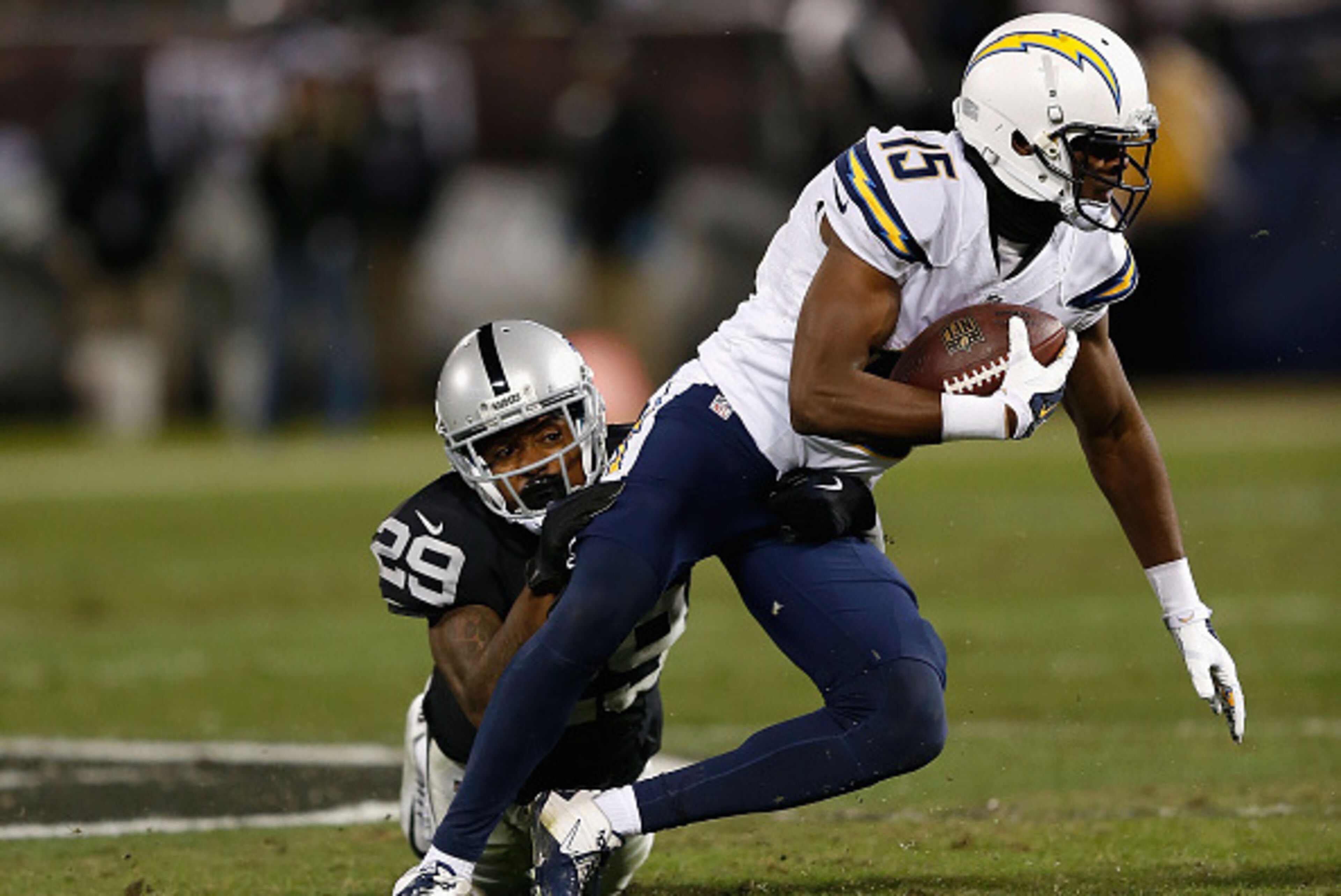 OAKLAND, CA - DECEMBER 24: Wide receiver Dontrelle Inman #15 of the San Diego Chargers is tackled by cornerback David Amerson #29 of the Oakland Raiders in the second quarter at O.co Coliseum on December 24, 2015 in Oakland, California. (Photo by Lachlan OAKLAND, CA - DECEMBER 24: Wide receiver Dontrelle Inman #15 of the San Diego Chargers is tackled by cornerback David Amerson #29 of the Oakland Raiders in the second quarter at O.co Coliseum on December 24, 2015 in Oakland, California. (Photo by Lachlan