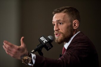 LAS VEGAS, NV - DECEMBER 12:  UFC featherweight champion Conor McGregor speaks to the media at the post fight press conference after his 13 second knockout victory over Jose Aldo in their featherweight championship fight during the UFC 194 event inside MG