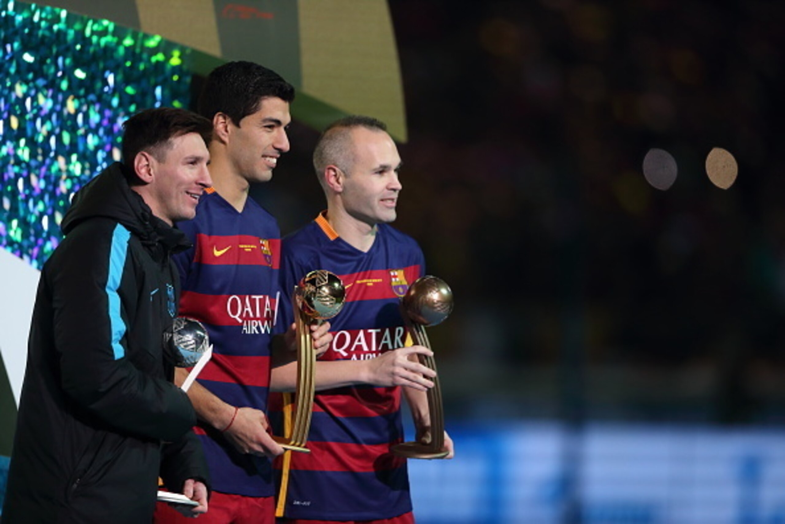 YOKOHAMA, JAPAN - DECEMBER 20:  Lionel Messi of FC Barcelona - Adidas Silver Ball winner, Luis Suarez of FC Barcelona - Adidas Gold Ball winner and Andres Iniesta of FC Barcelona - Adidas Bronze Ball winner during the FIFA Club World Cup Final Match betwe
