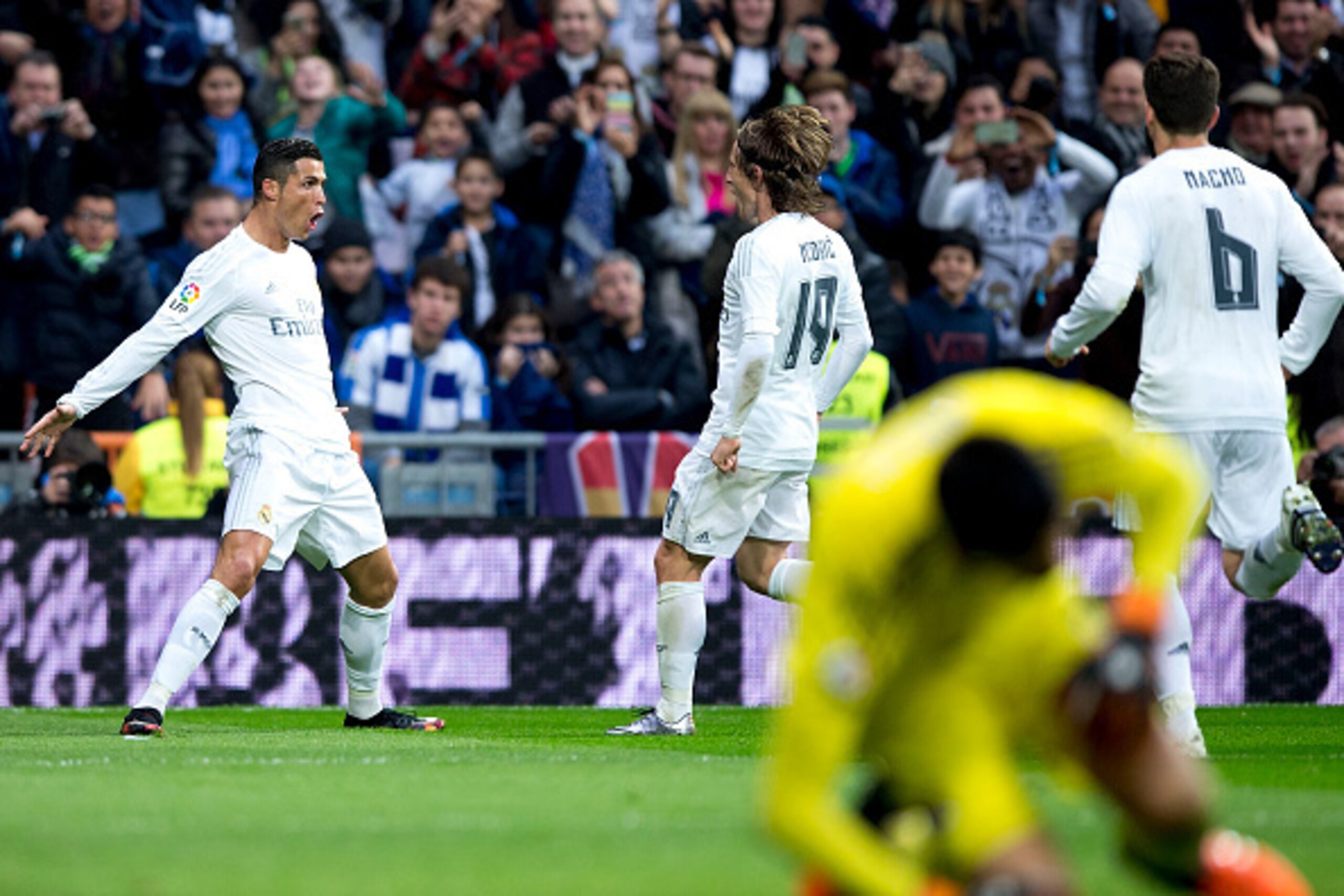 MADRID, SPAIN - DECEMBER 30:  Cristiano Ronaldo (L) of Real Madrid CF celebrates scoring their second goal with teammates during the La Liga match between Real Madrid CF and Real Sociedad de Futbol at Estadio Santiago Bernabeu on December 30, 2015 in Madr