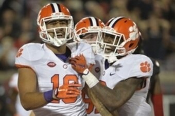 Sep 17, 2015; Louisville, KY, USA; Clemson Tigers tight end Jordan Leggett (16) celebrates with running back Wayne Gallman (9) after scoring a touch down against the Louisville Cardinals during the second half at Papa John's Cardinal Stadium. Clemson defe