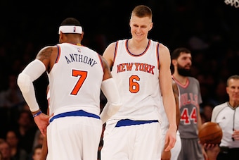 NEW YORK, NY - DECEMBER 19:  Kristaps Porzingis #6 and Carmelo Anthony #7 of the New York Knicks looks on against the Chicago Bulls at Madison Square Garden on December 19, 2015 in New York City.  Knicks defeated the Bulls 107-91. NOTE TO USER: User expre