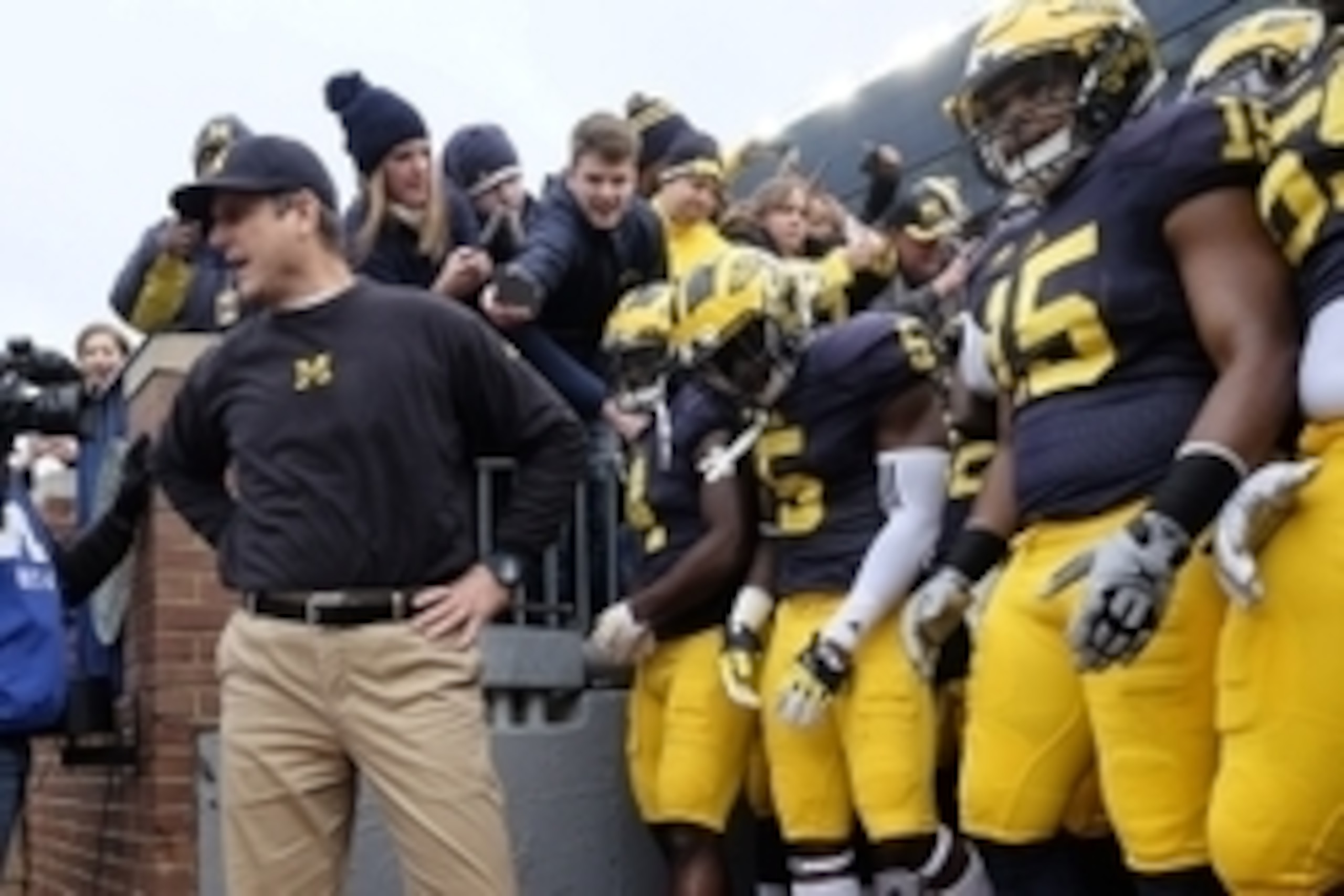 Nov 28, 2015; Ann Arbor, MI, USA; Michigan Wolverines head coach Jim Harbaugh gets set to take the field prior to the game against the Ohio State Buckeyes at Michigan Stadium. Mandatory Credit: Rick Osentoski-USA TODAY Sports