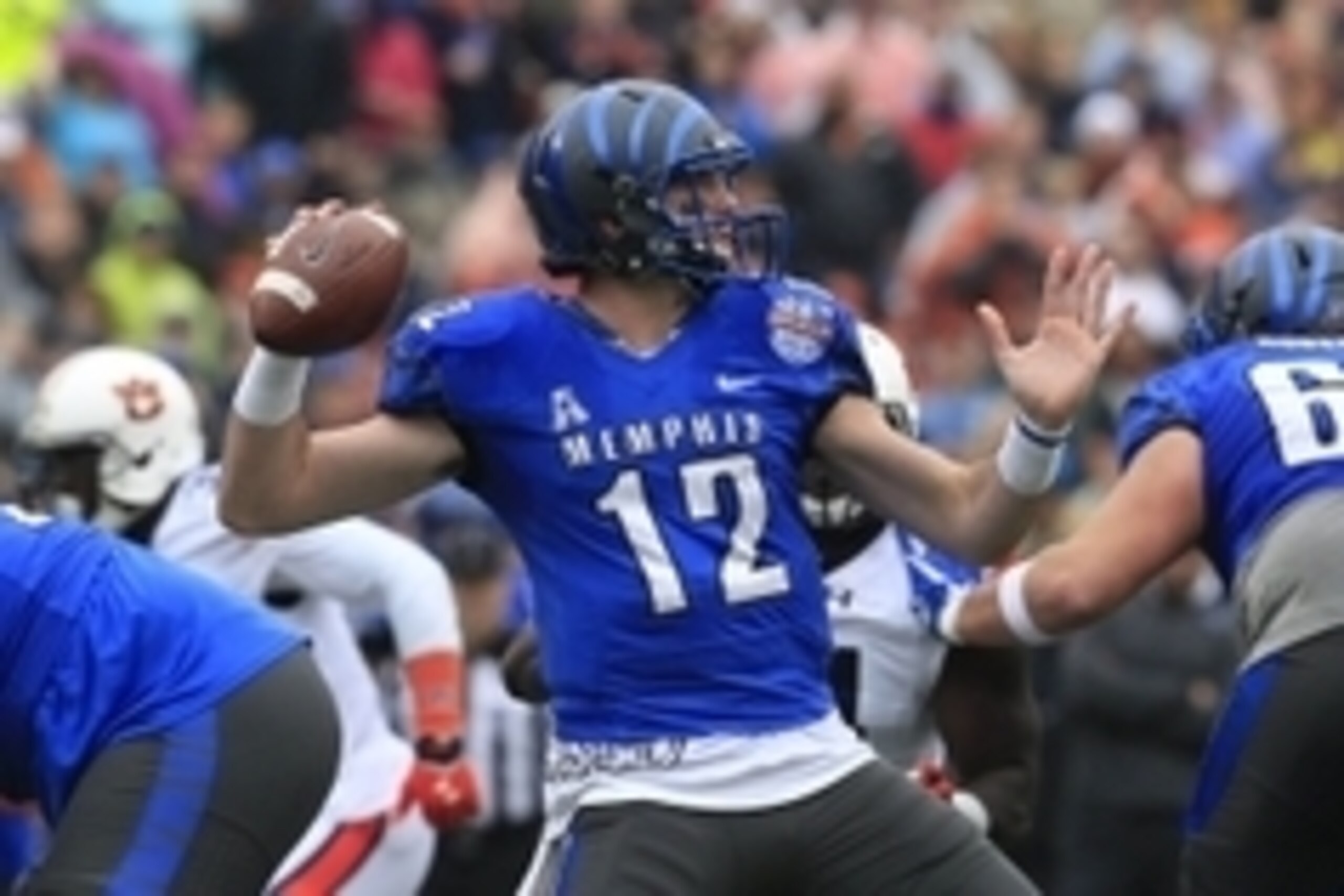 Dec 30, 2015; Birmingham, AL, USA; Memphis Tigers quarterback Paxton Lynch (12) drops back to pass against Auburn Tigers in the 2015 Birmingham Bowl at Legion Field. Mandatory Credit: Marvin Gentry-USA TODAY Sports
