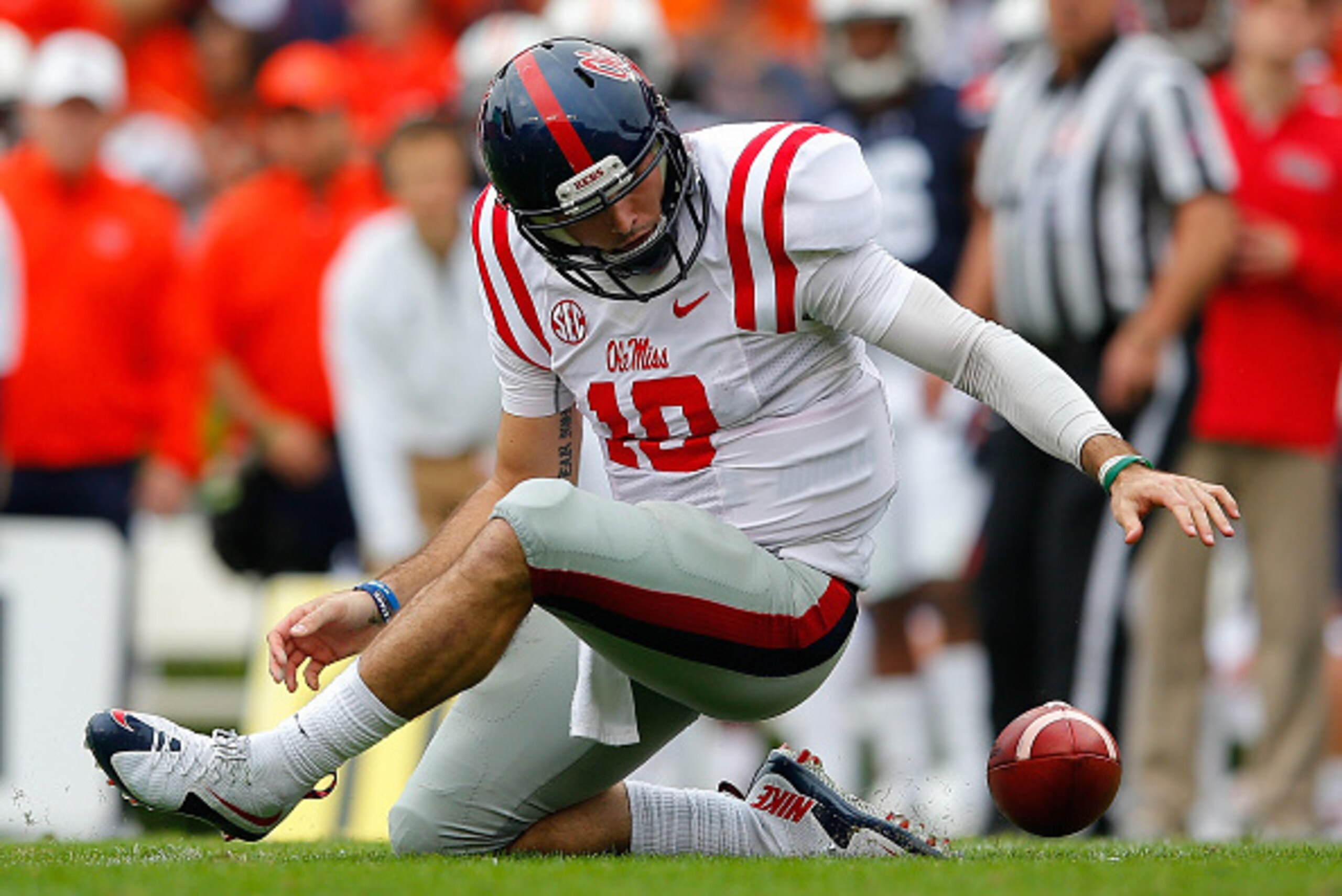 AUBURN, AL - OCTOBER 31:  Chad Kelly #10 of the Mississippi Rebels fumbles the ball against the Auburn Tigers at Jordan-Hare Stadium on October 31, 2015 in Auburn, Alabama.  (Photo by Kevin C. Cox/Getty Images)