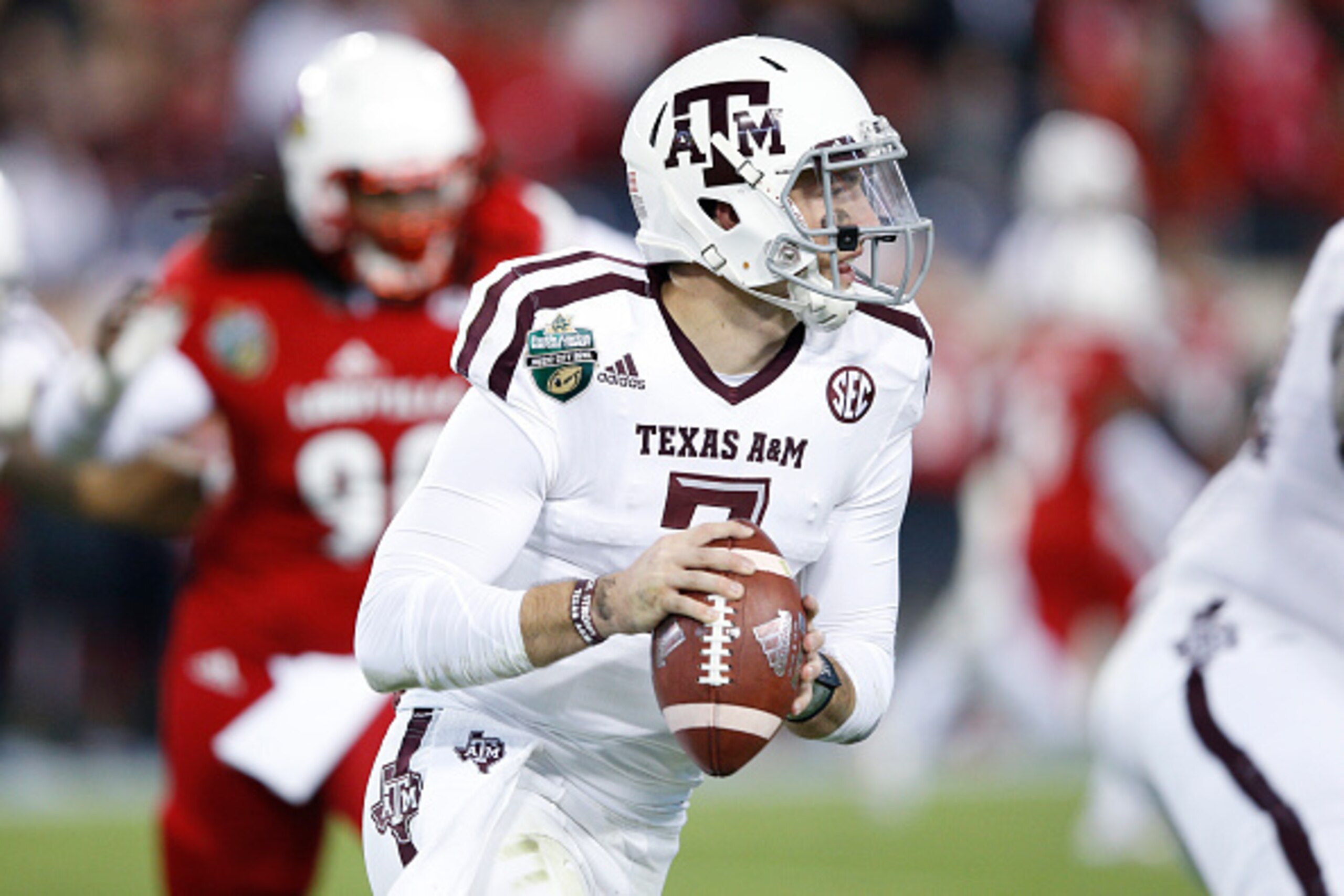NASHVILLE, TN - DECEMBER 30: Jake Hubenak #7 of the Texas A&M Aggies looks to pass against the Louisville Cardinals in the first half of the Franklin American Mortgage Music City Bowl at Nissan Stadium on December 30, 2015 in Nashville, Tennessee. (Photo