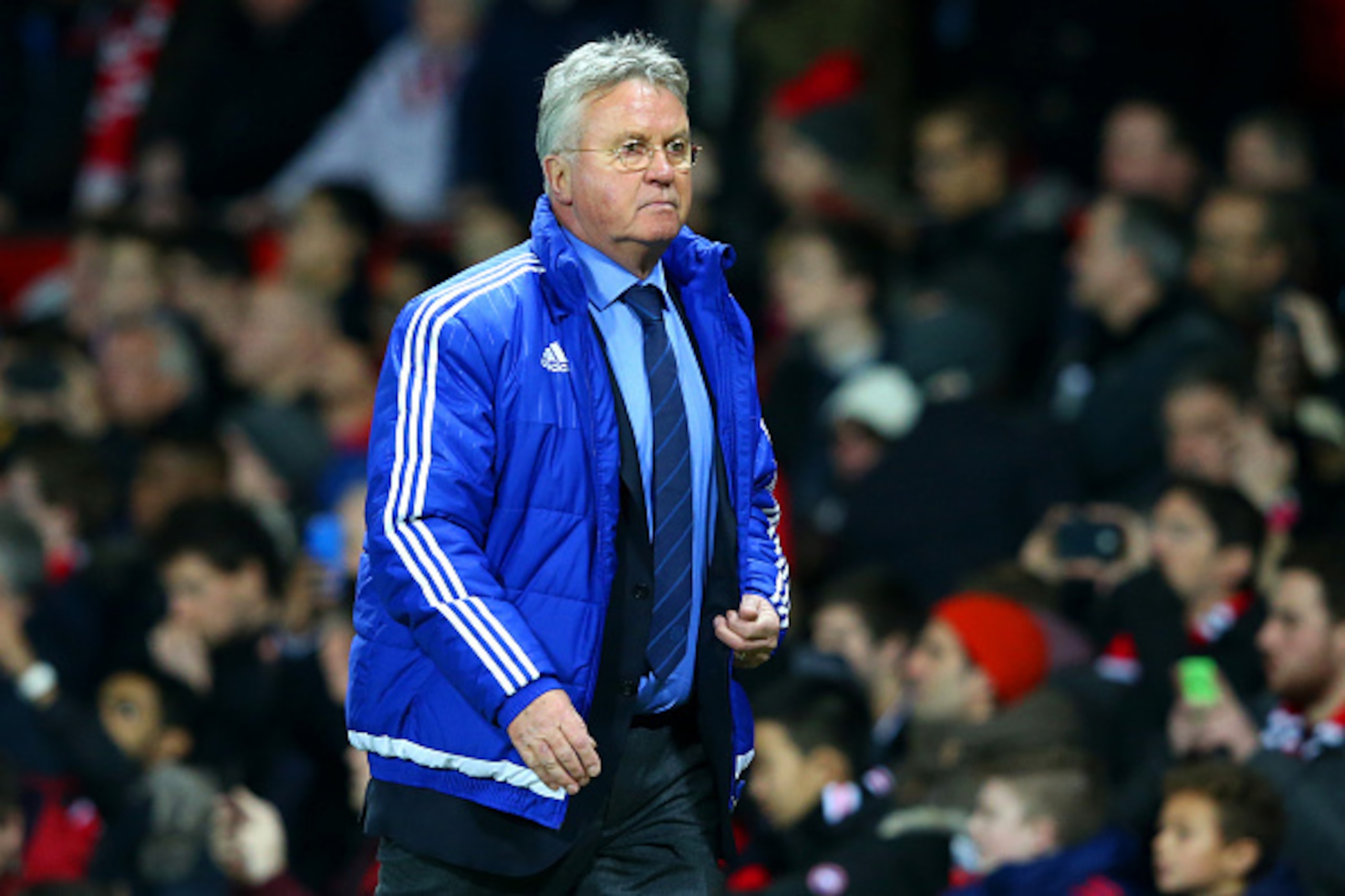 MANCHESTER, ENGLAND - DECEMBER 28:  Guus Hiddink, manager of Chelsea looks on as he walks back to the changing room at half time during the Barclays Premier League match between Manchester United and Chelsea at Old Trafford on December 28, 2015 in Manches