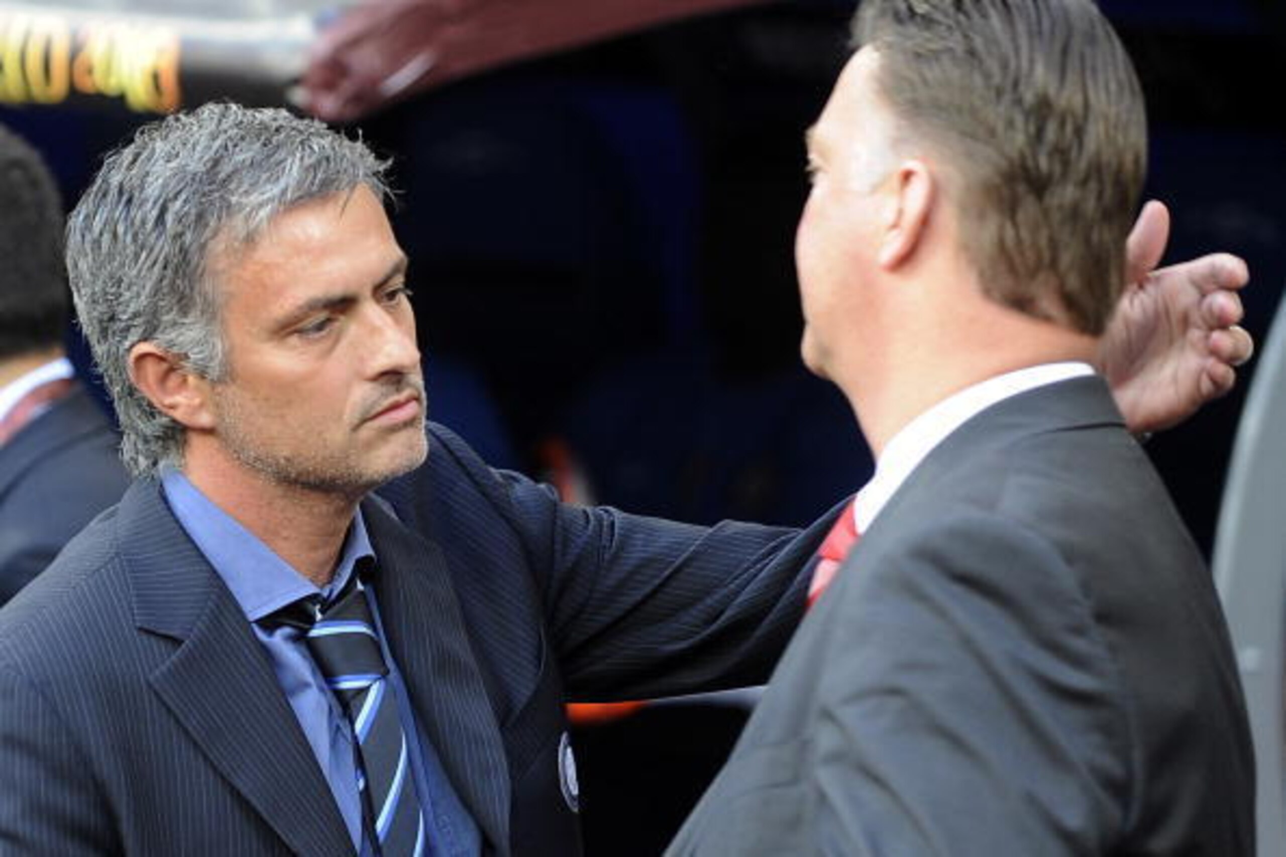 Bayern Munich's Dutch head coach Louis van Gaal (R) and Inter Milan's Portuguese  coach Jose Mourinho cheer each other before the UEFA Champions League final football match Inter Milan against Bayern Munich at the Santiago Bernabeu stadium in Madrid on Ma