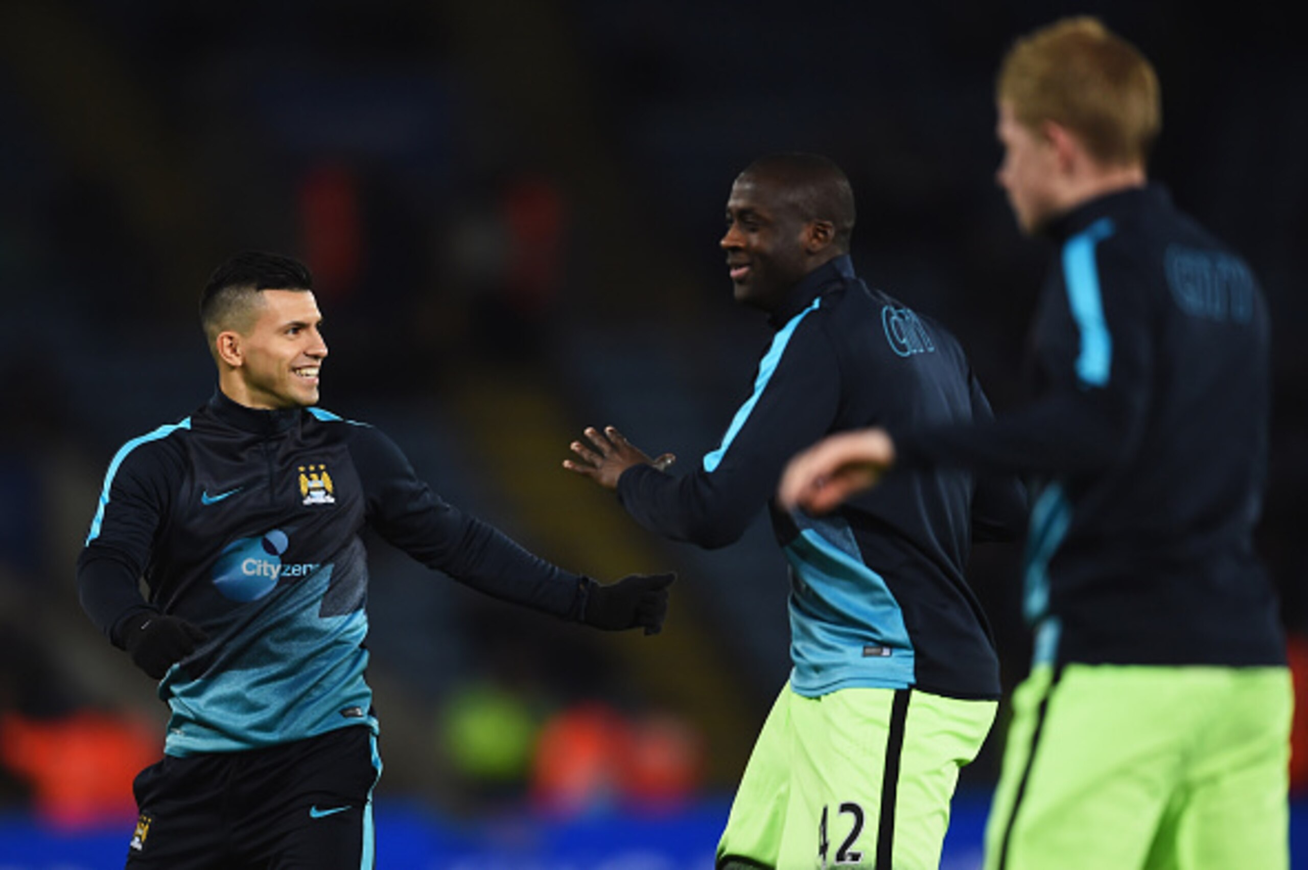 LEICESTER, ENGLAND - DECEMBER 29:  Sergio Aguero of Manchester City (L) smiles as he warms up with team mates Yaya Toure and Kevin de Bruyne prior to the Barclays Premier League match between Leicester City and Manchester City at The King Power Stadium on