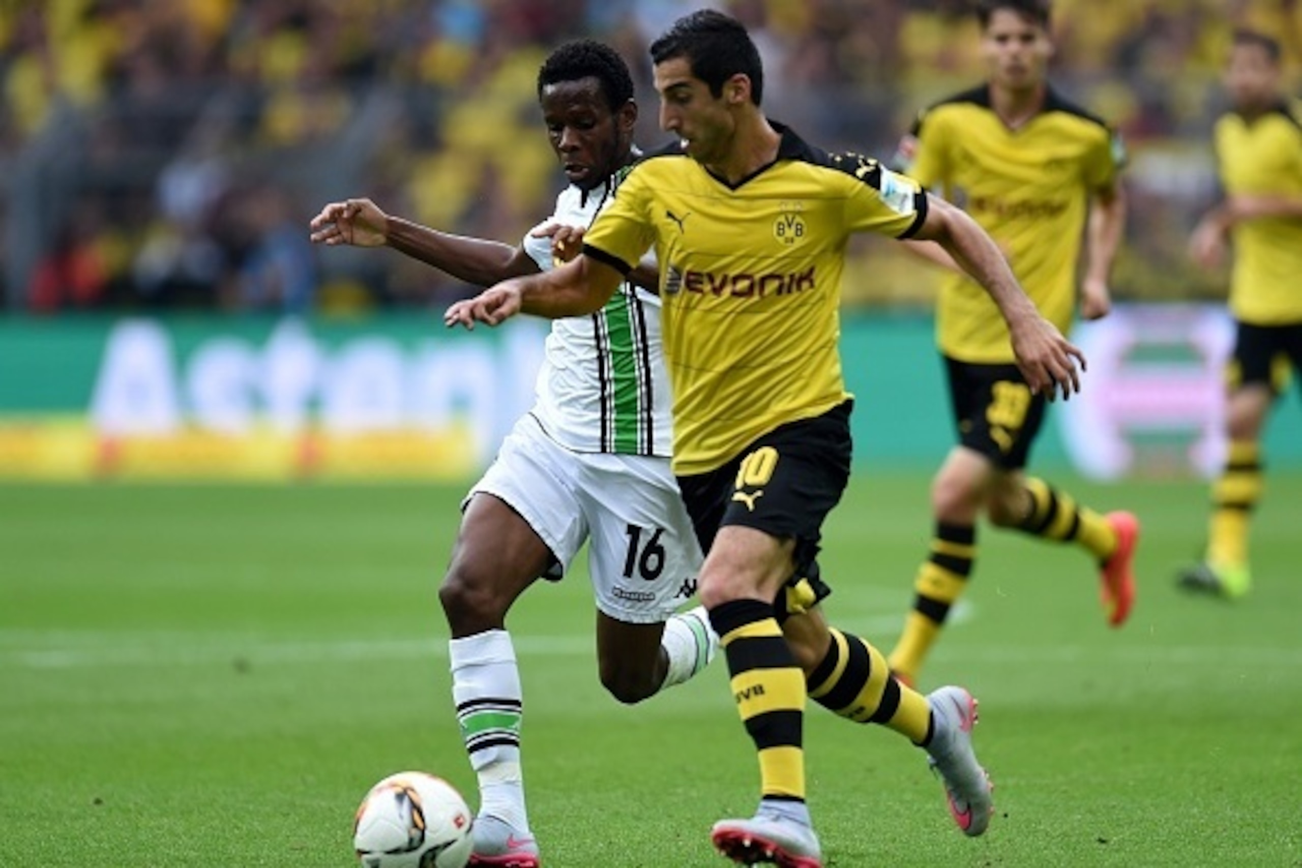 Dortmund's Armenian midfielder Henrikh Mkhitaryan and Moenchengladbach's Guinean midfielder Ibrahima Traore vie for the ball during the German first division Bundesliga football match Borussia Dortmund vs Borussia Moenchengladbach in Dortmund, western Ger