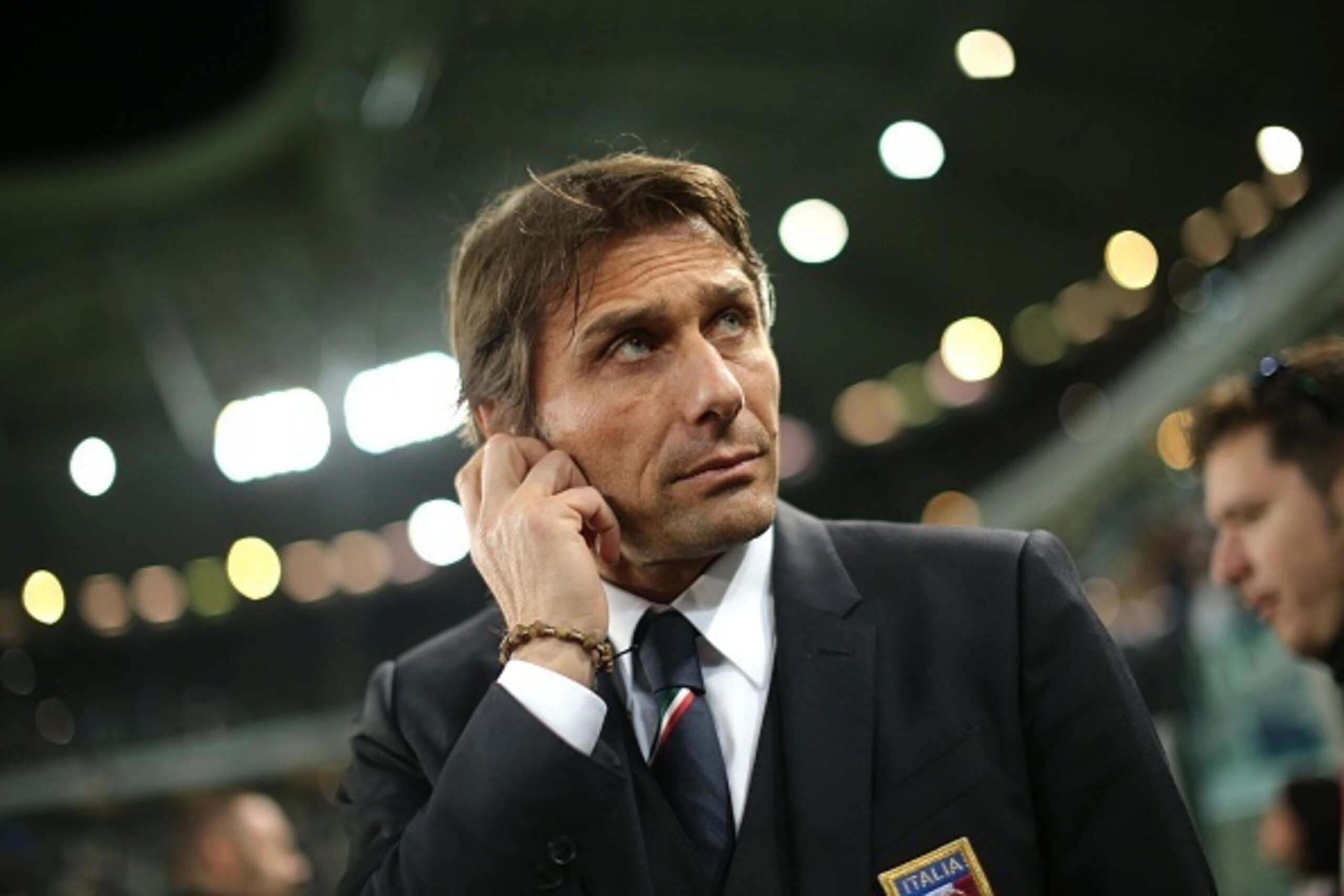 Italy coach Antonio Conte waits on March 31, 2015 before a friendly football match Italy vs England at the Juventus Stadium in Turin. AFP PHOTO / MARCO BERTORELLO (Photo credit should read MARCO BERTORELLO/AFP/Getty Images) Italy coach Antonio Conte waits on March 31, 2015 before a friendly football match Italy vs England at the Juventus Stadium in Turin. AFP PHOTO / MARCO BERTORELLO (Photo credit should read MARCO BERTORELLO/AFP/Getty Images)