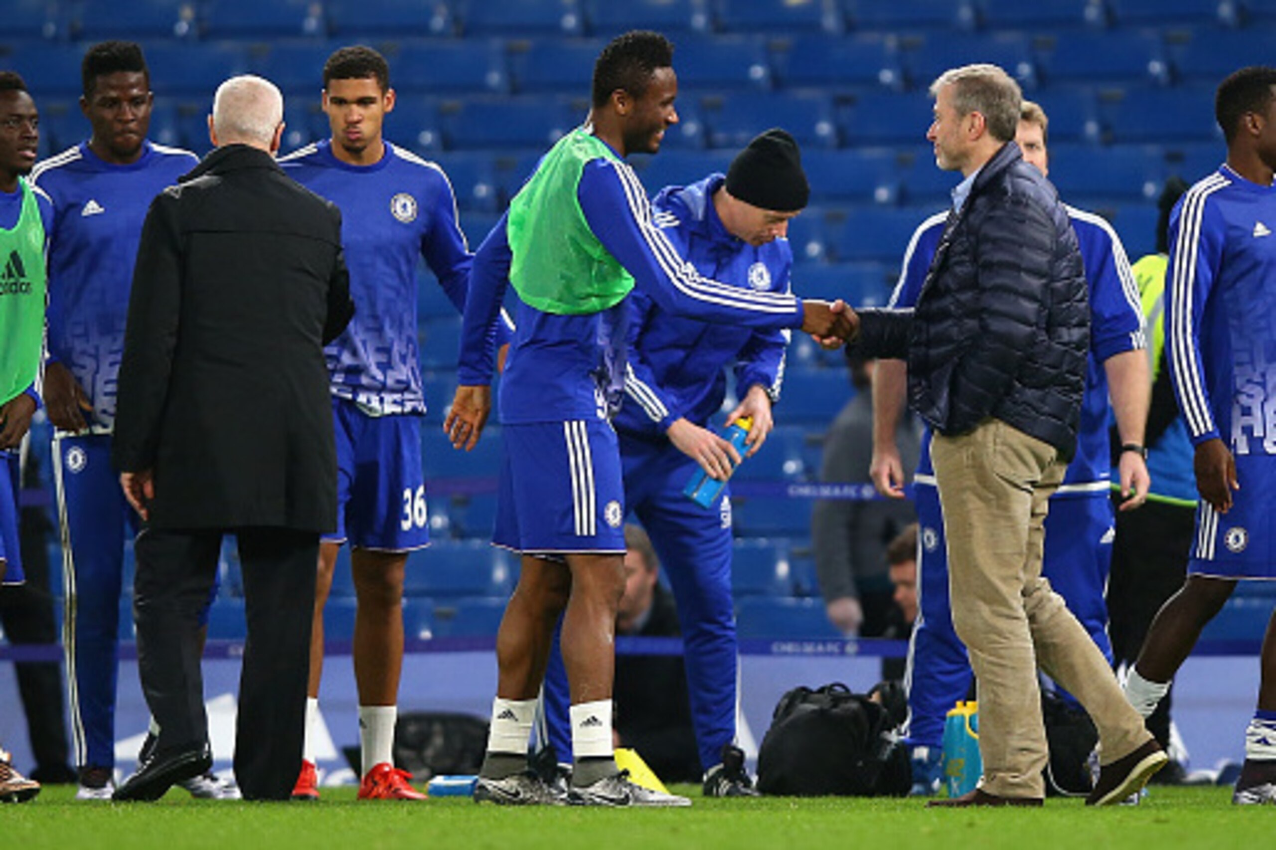 LONDON, ENGLAND - DECEMBER 19:  Chelsea owner Roman Abramovich shakes hands with John Mikel Obi of Chelsea to congratulate the 3-1 win in the Barclays Premier League match between Chelsea and Sunderland at Stamford Bridge on December 19, 2015 in London, E