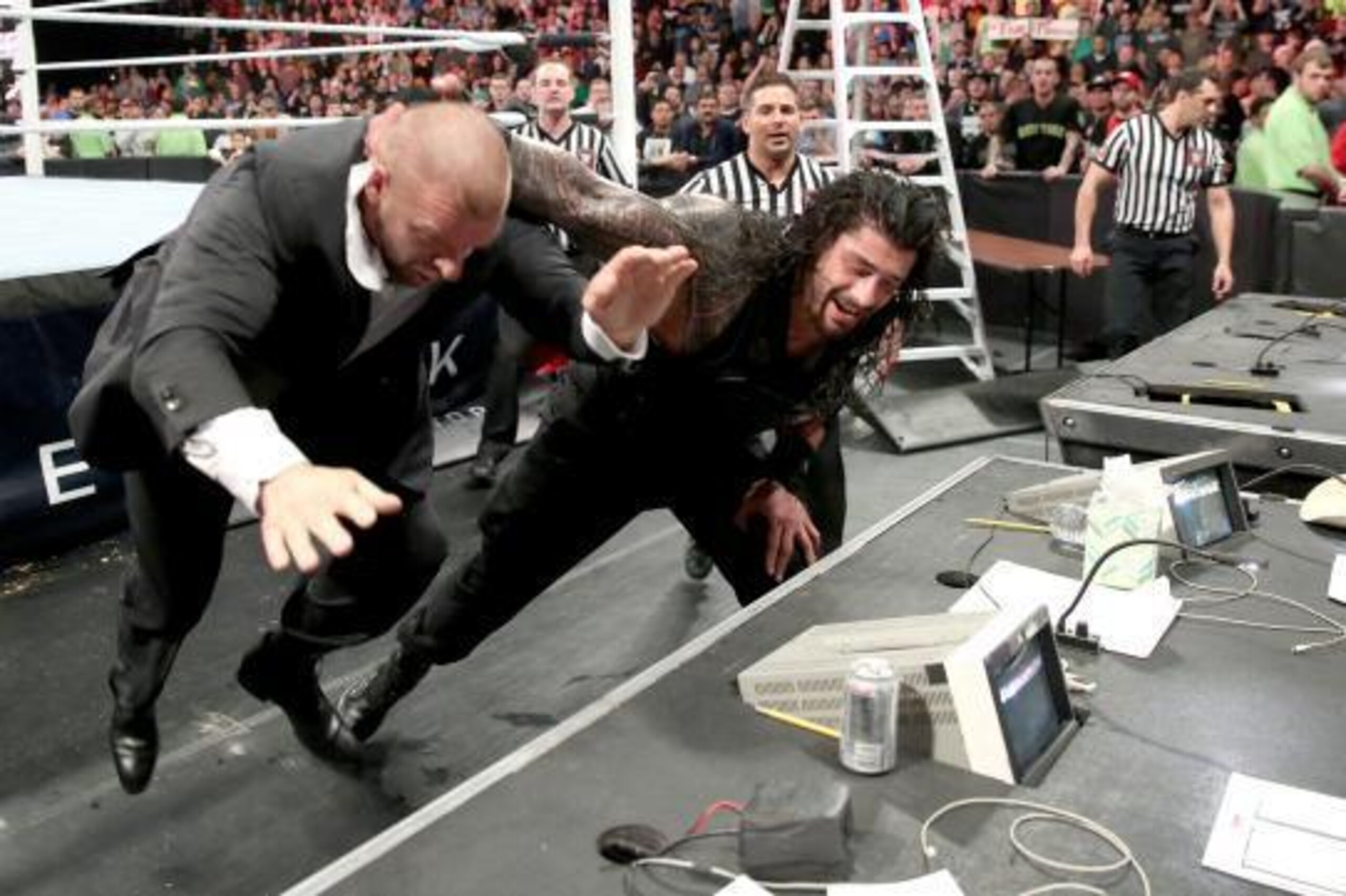 Roman Reigns attacks Triple H at TLC.