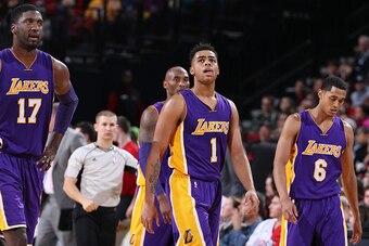 PORTLAND, OR - NOVEMBER 28:  Roy Hibbert #17, D'Angelo Russell #1 and Jordan Clarkson #6 of the Los Angeles Lakers look during the game against the Portland Trail Blazers on on November 28, 2015 at the Moda Center in Portland, Oregon. NOTE TO USER: User e