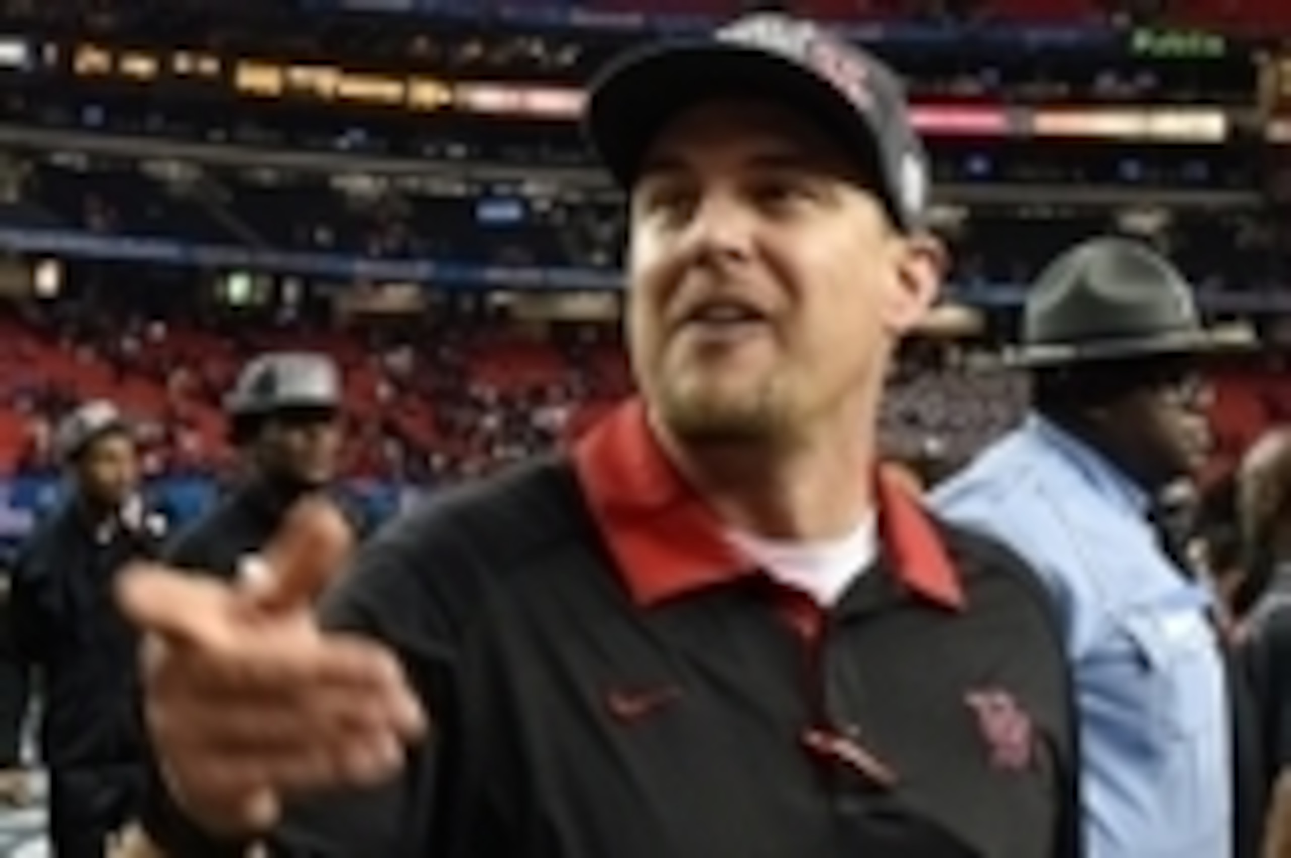 Dec 31, 2015; Atlanta, GA, USA; Houston Cougars head coach Tom Herman (C) walks on the field after winning the Peach Bowl against the Florida State Seminoles 38-24 at the Georgia Dome. Mandatory Credit: Dale Zanine-USA TODAY Sports