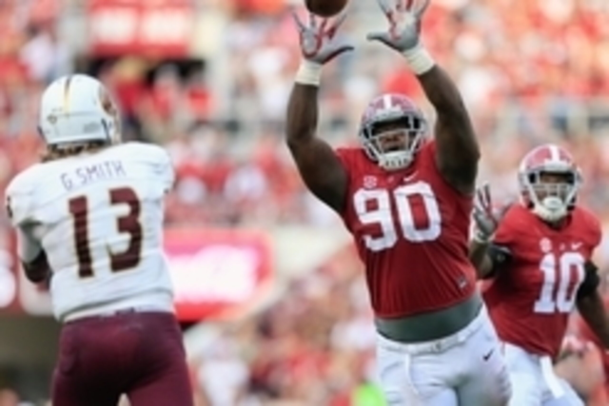 Sep 26, 2015; Tuscaloosa, AL, USA; Alabama Crimson Tide defensive lineman Jarran Reed (90) knocks down the pass of Louisiana Monroe Warhawks quarterback Garrett Smith (13) at Bryant-Denny Stadium. The Tide defeated the Warhawks 34-0. Mandatory Credit: Mar