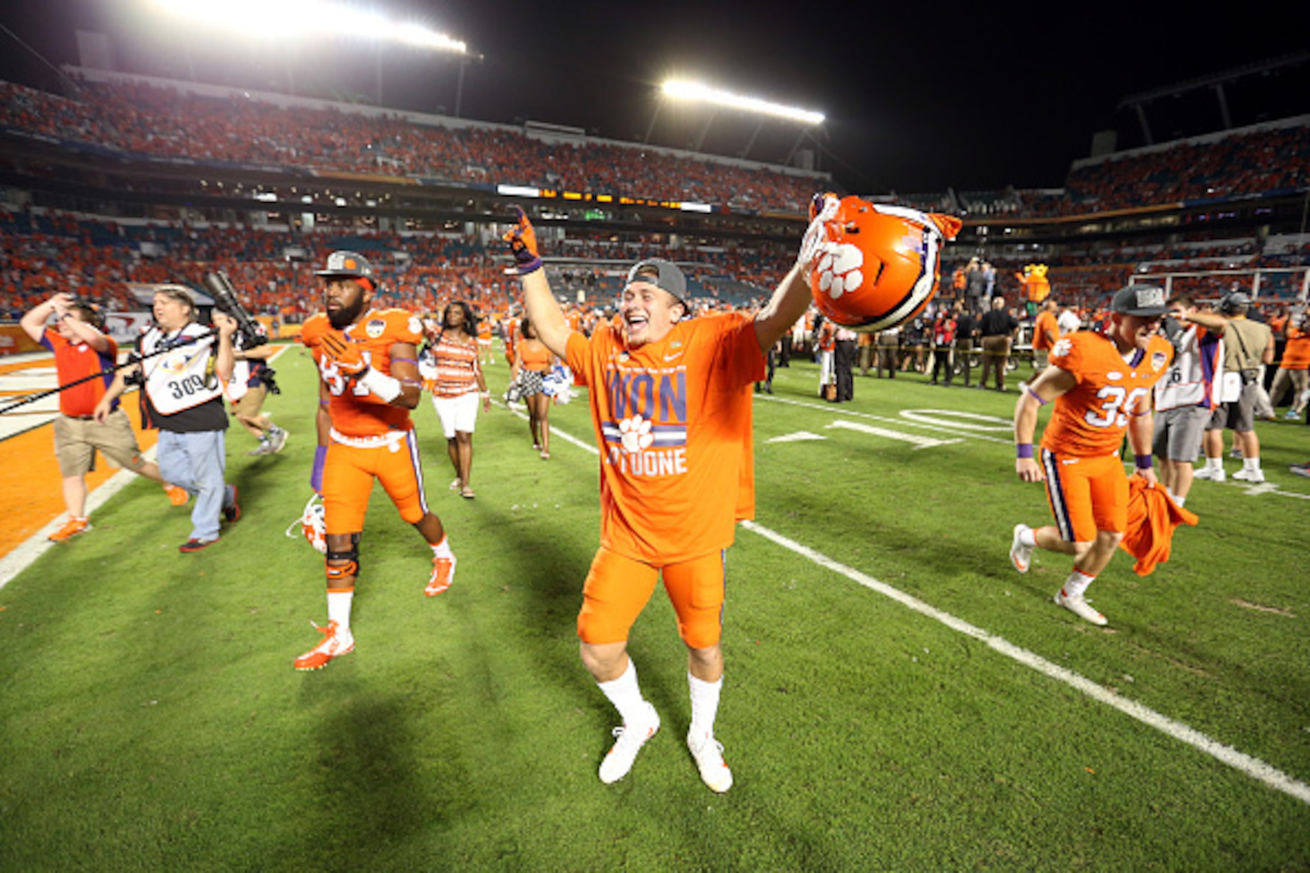 MIAMI GARDENS, FL - DECEMBER 31:  Clemson Tigers players celebrate defeating the Oklahoma Sooners with a score of 37 to 17 to win the 2015 Capital One Orange Bowl at Sun Life Stadium on December 31, 2015 in Miami Gardens, Florida.  (Photo by Streeter Leck