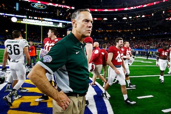 ARLINGTON, TX - DECEMBER 31:  Head coach Mark Dantonio reacts at midfield after losing 38-0 to the Alabama Crimson Tide during the Goodyear Cotton Bowl at AT&T Stadium on December 31, 2015 in Arlington, Texas.  (Photo by Scott Halleran/Getty Images)