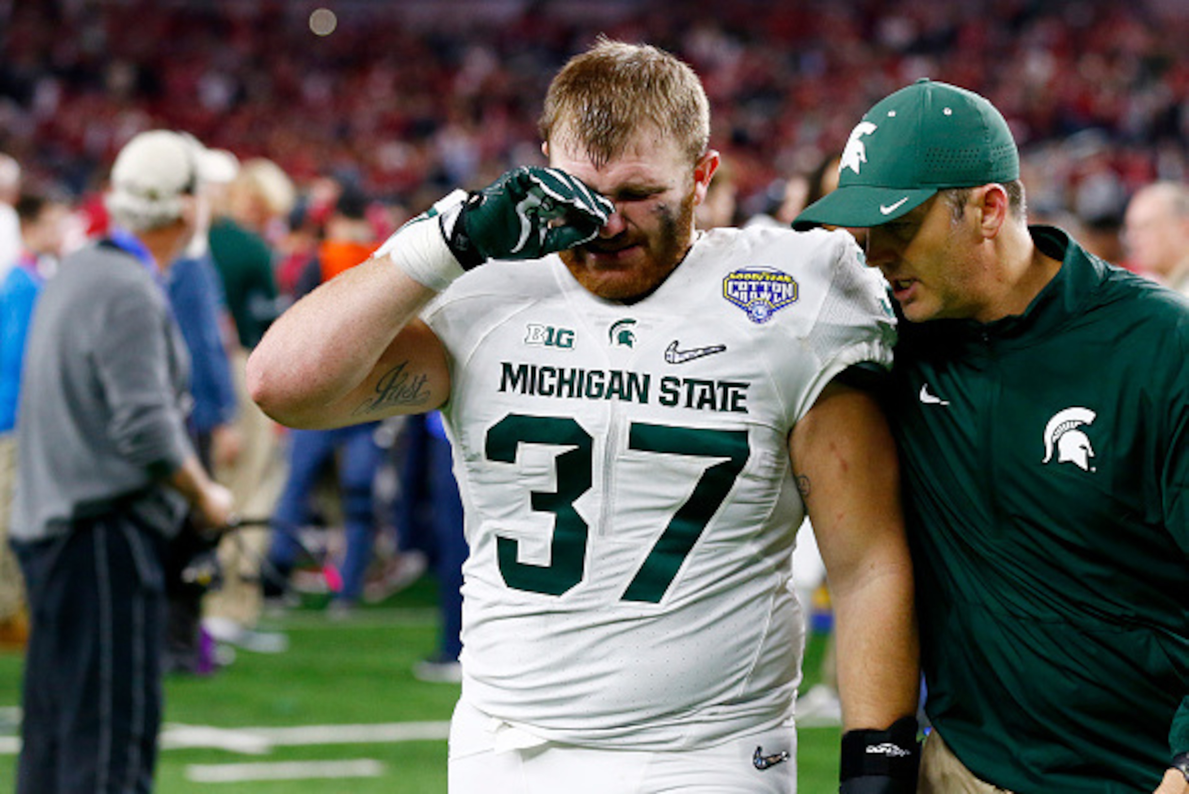 ARLINGTON, TX - DECEMBER 31: Trevon Pendleton #37 of the Michigan State Spartans reacts as he walks off the field after losing 38-0 to the Alabama Crimson Tide during the Goodyear Cotton Bowl at AT&T Stadium on December 31, 2015 in Arlington, Texas. (Ph ARLINGTON, TX - DECEMBER 31: Trevon Pendleton #37 of the Michigan State Spartans reacts as he walks off the field after losing 38-0 to the Alabama Crimson Tide during the Goodyear Cotton Bowl at AT&T Stadium on December 31, 2015 in Arlington, Texas. (Ph