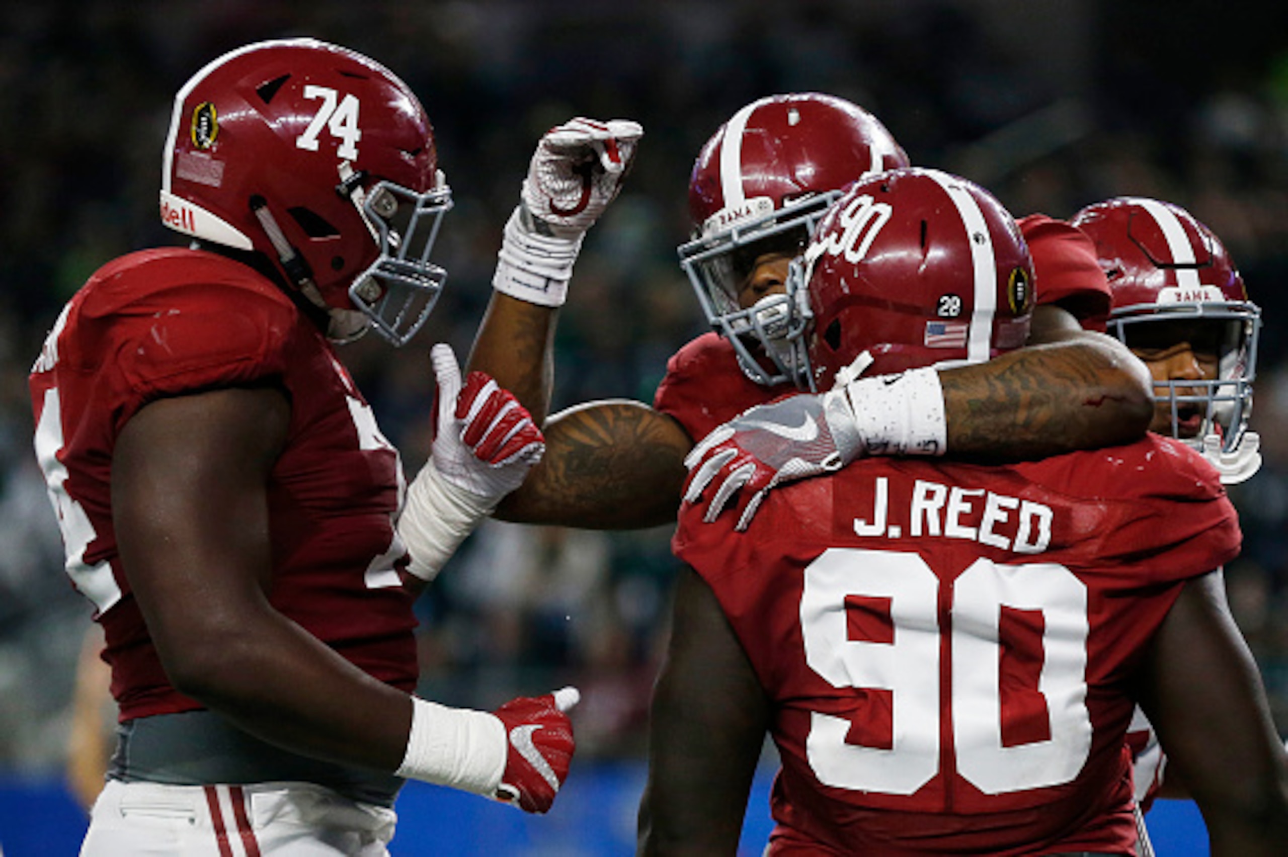 ARLINGTON, TX - DECEMBER 31: Derrick Henry #2 of the Alabama Crimson Tide celebrates scoring a touchdown in the second quarter with teammates offensive lineman Cam Robinson #74 and Jarran Reed #90 against the Michigan State Spartans during the Goodyear C ARLINGTON, TX - DECEMBER 31: Derrick Henry #2 of the Alabama Crimson Tide celebrates scoring a touchdown in the second quarter with teammates offensive lineman Cam Robinson #74 and Jarran Reed #90 against the Michigan State Spartans during the Goodyear C