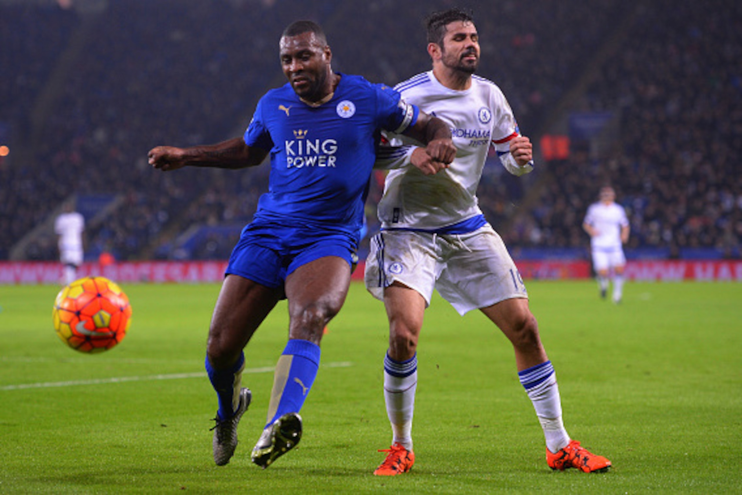 LEICESTER, ENGLAND - DECEMBER 14:  Wes Morgan of Leicester City and Diego Costa of Chelsea battle for the ball during the Barclays Premier League match between Leicester City and Chelsea at the King Power Stadium on December14, 2015 in Leicester, United K