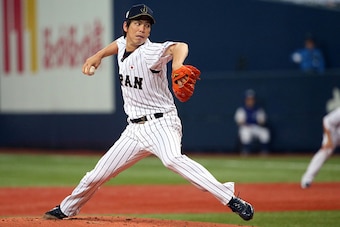 OSAKA, JAPAN - NOVEMBER 12:  Starting pitcher Kenta Maeda #18 of the Samurai Japan pitches in the first inning during the Game one of Samurai Japan and MLB All Stars at Kyocera Dome Osaka on November 12, 2014 in Osaka, Japan.  (Photo by Atsushi Tomura/Get