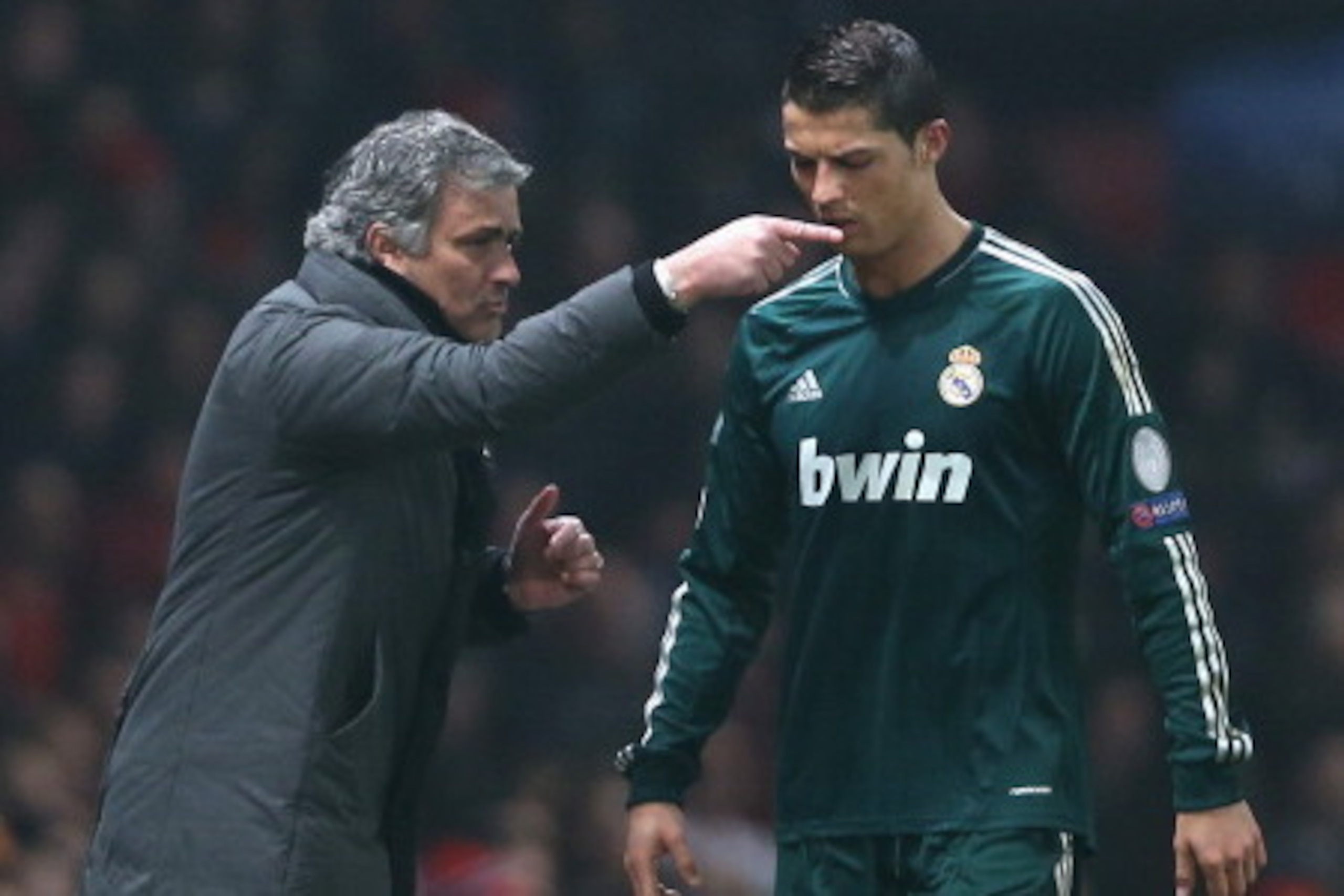 MANCHESTER, ENGLAND - MARCH 05:  Real Madrid Manager Jose Mourinho gives orders to Cristiano Ronaldo during the UEFA Champions League Round of 16 Second leg match between Manchester United and Real Madrid at Old Trafford on March 5, 2013 in Manchester, Un
