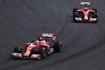 SAO PAULO, BRAZIL - NOVEMBER 09:  Fernando Alonso of Spain and Ferrari leads Kimi Raikkonen of Finland and Ferrari during the Brazilian Formula One Grand Prix at Autodromo Jose Carlos Pace on November 9, 2014 in Sao Paulo, Brazil.  (Photo by Dan Istitene/